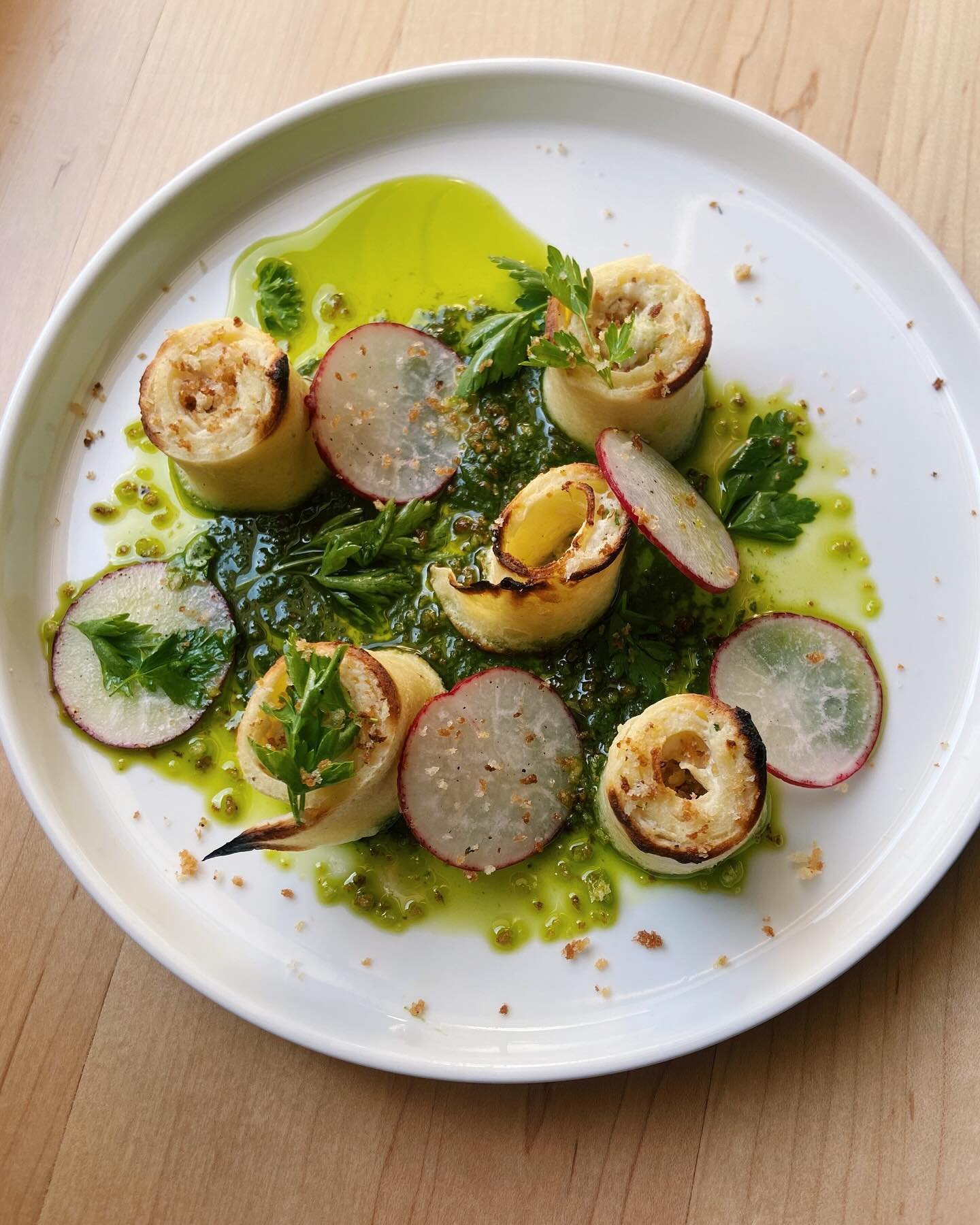 Spring on a plate: our new spring onion crespelle with ricotta, salsa verde and fresh radish 🌿🍽️
