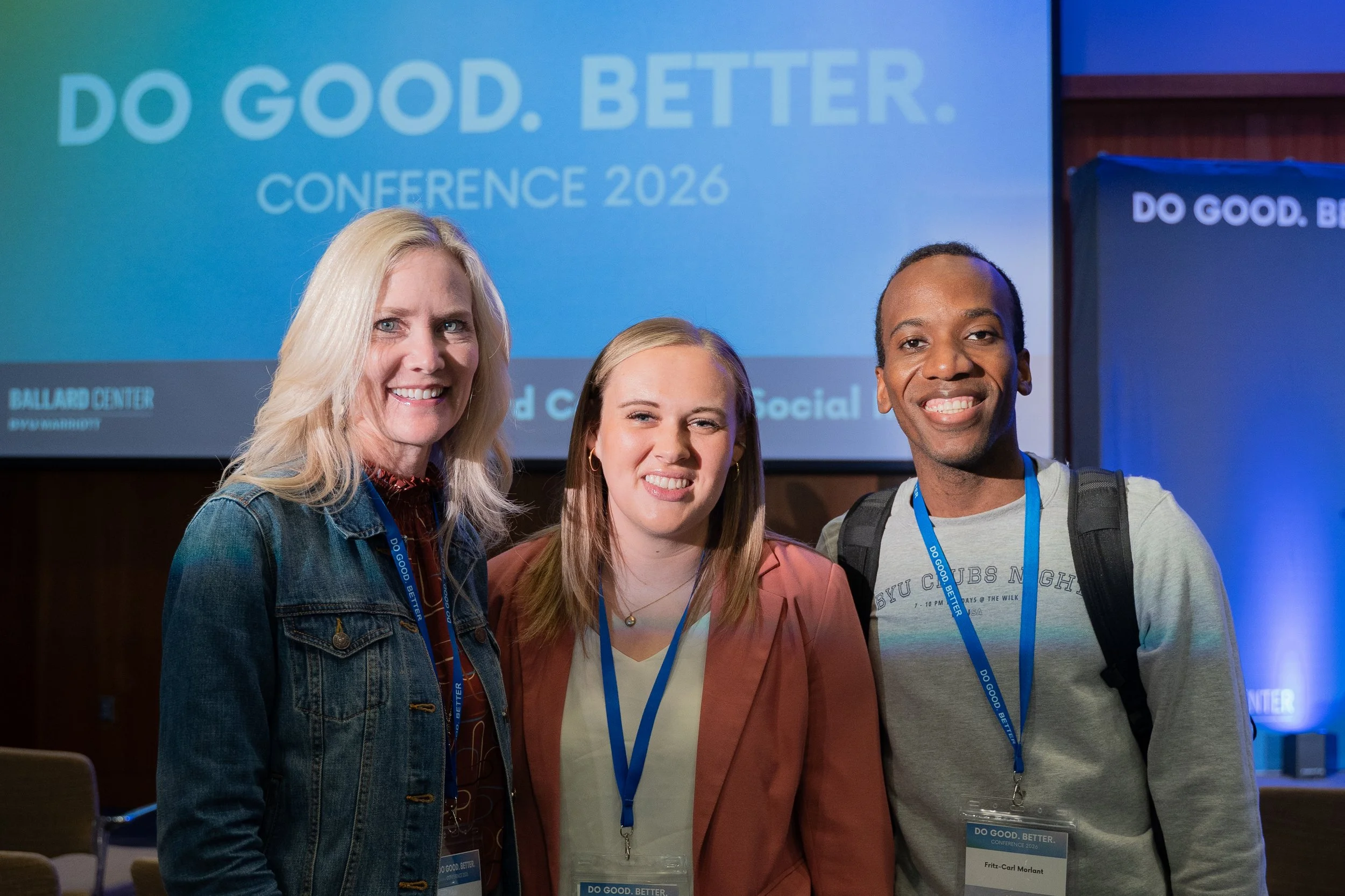 3 women standing in front of the Do Good. Better. Conference 2026 sign
