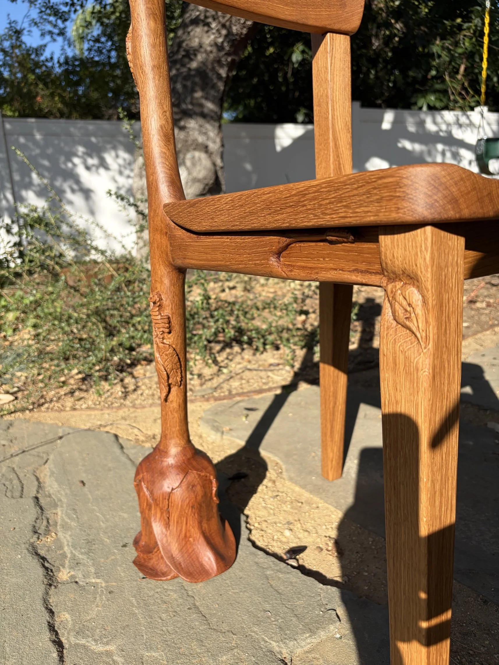 Carved white oak vanity/desk chair featuring saddled seat, carved rose stem, leaves, and flower, and a pair of sea horses!