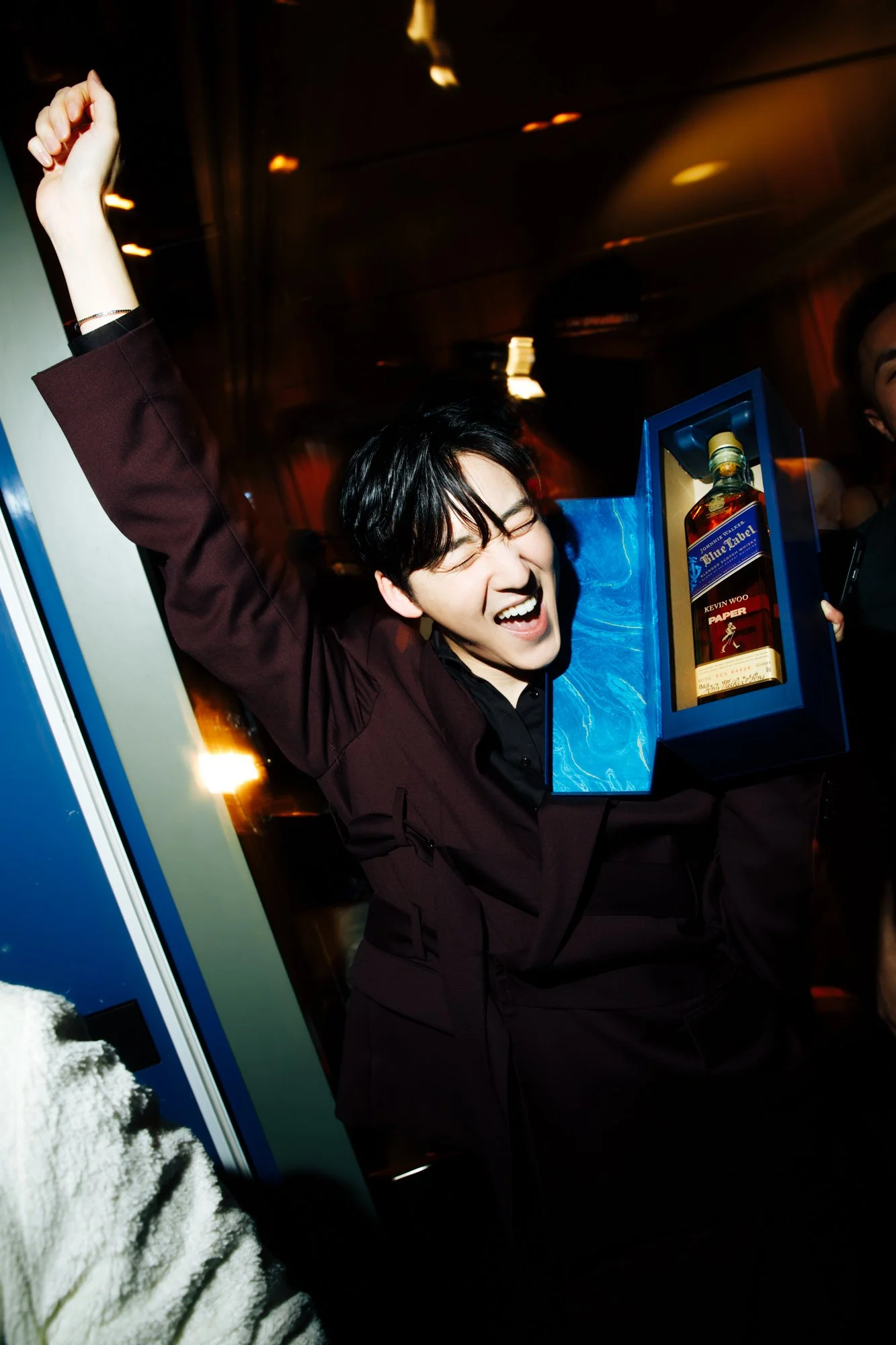 Kevin Woo with JW Blue bottle engraved with his name