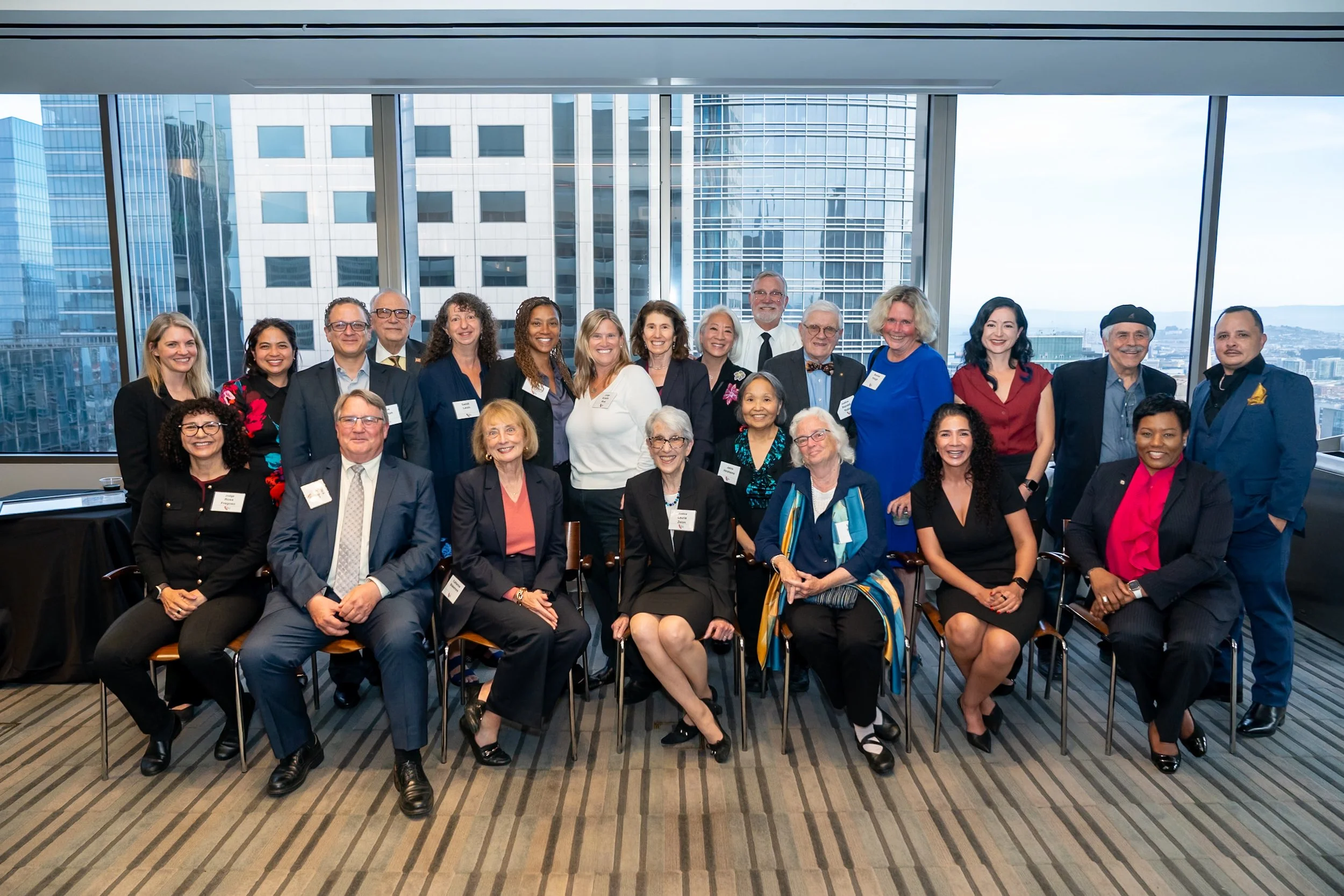 Group photo of 23 current and past Commissioners.