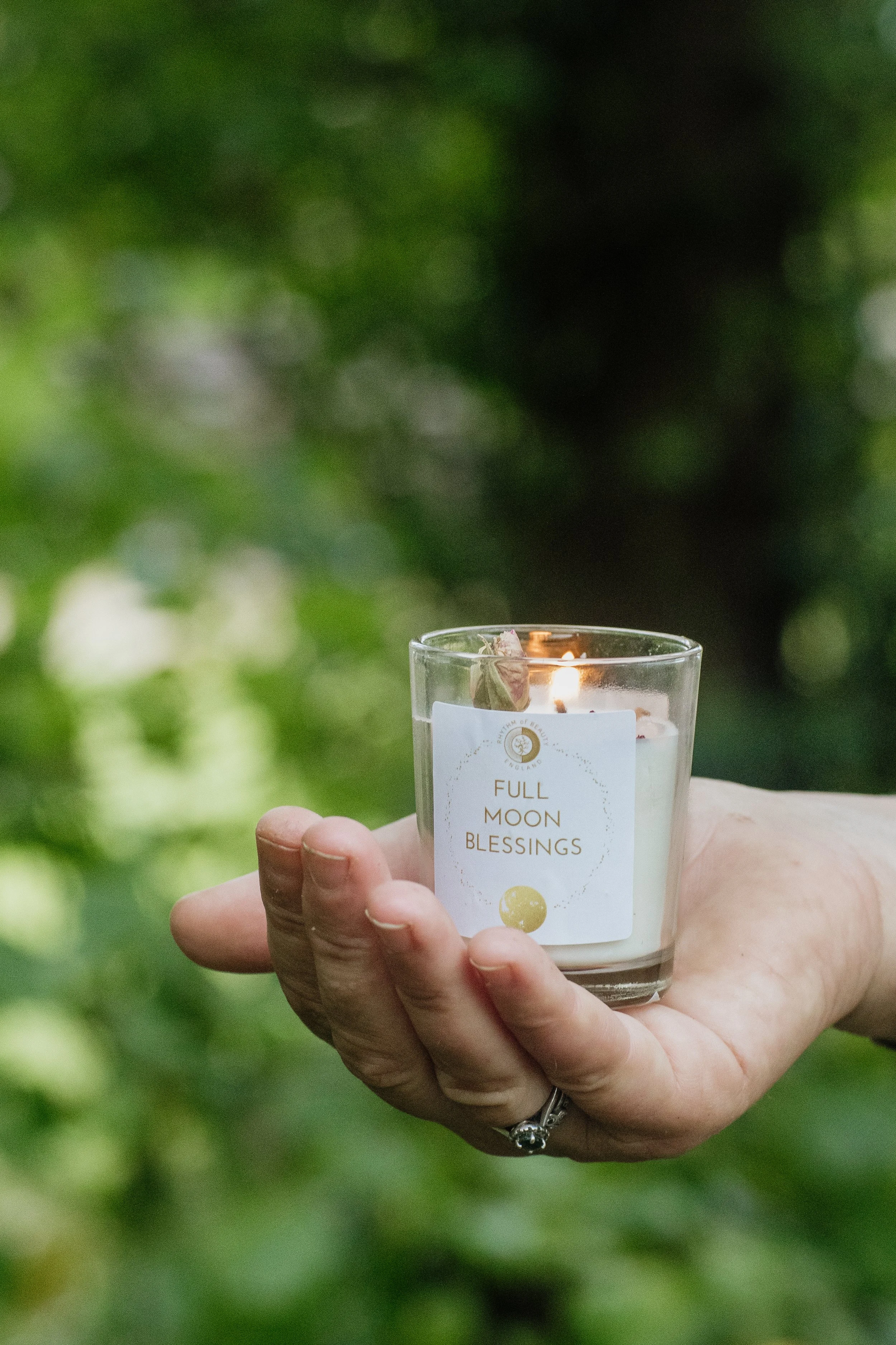 full moon candle in green leaves.jpg