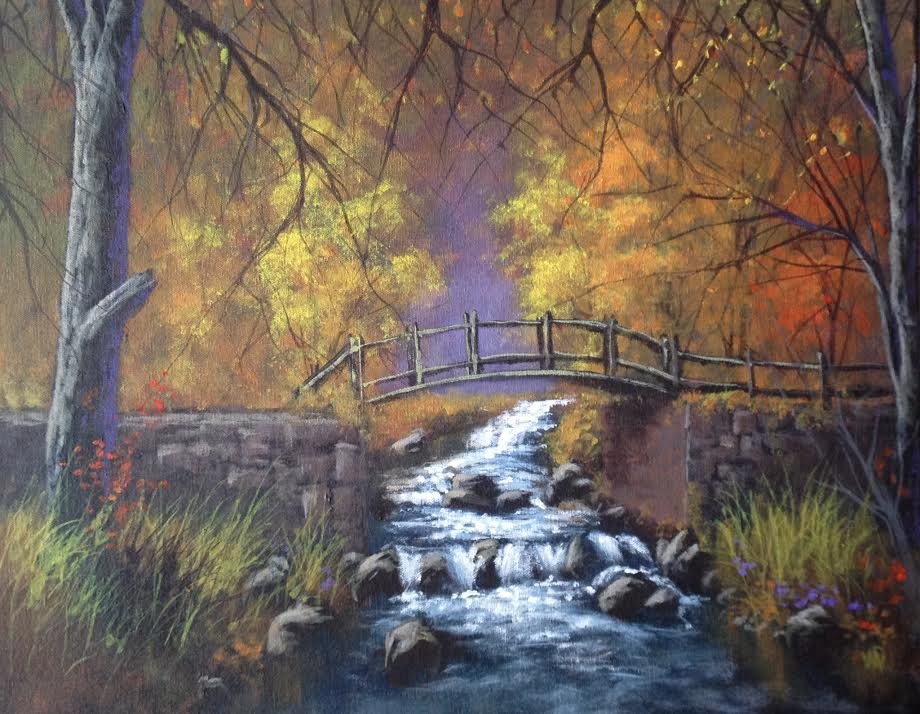 wooden bridge over creek orange green brown fall trees