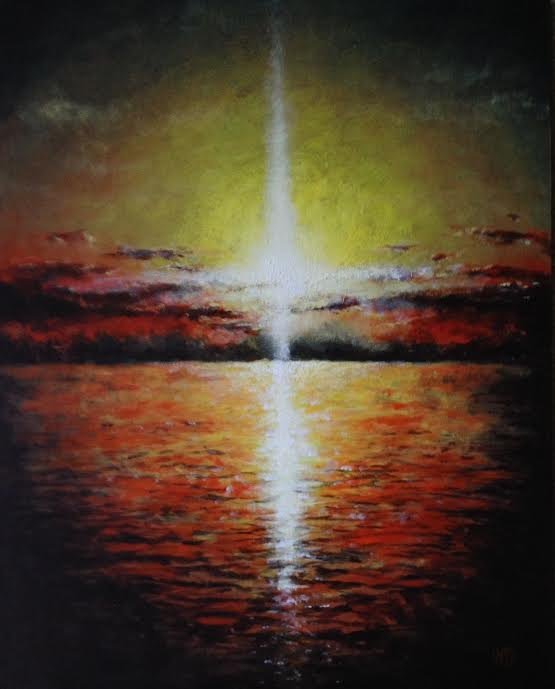 cross shaped sun rays sunset over red seas ocean and clouds