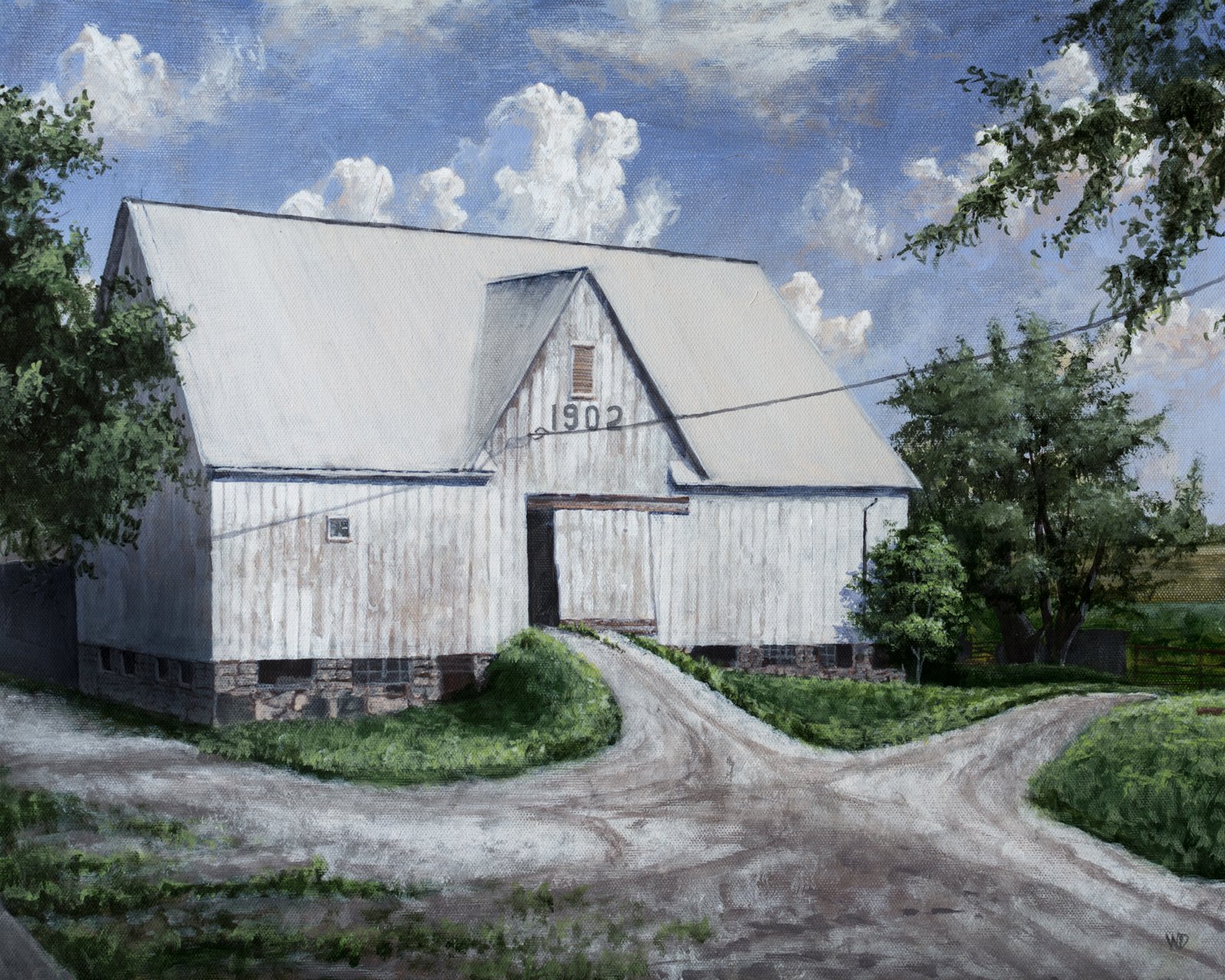 big white barn with trees driveway