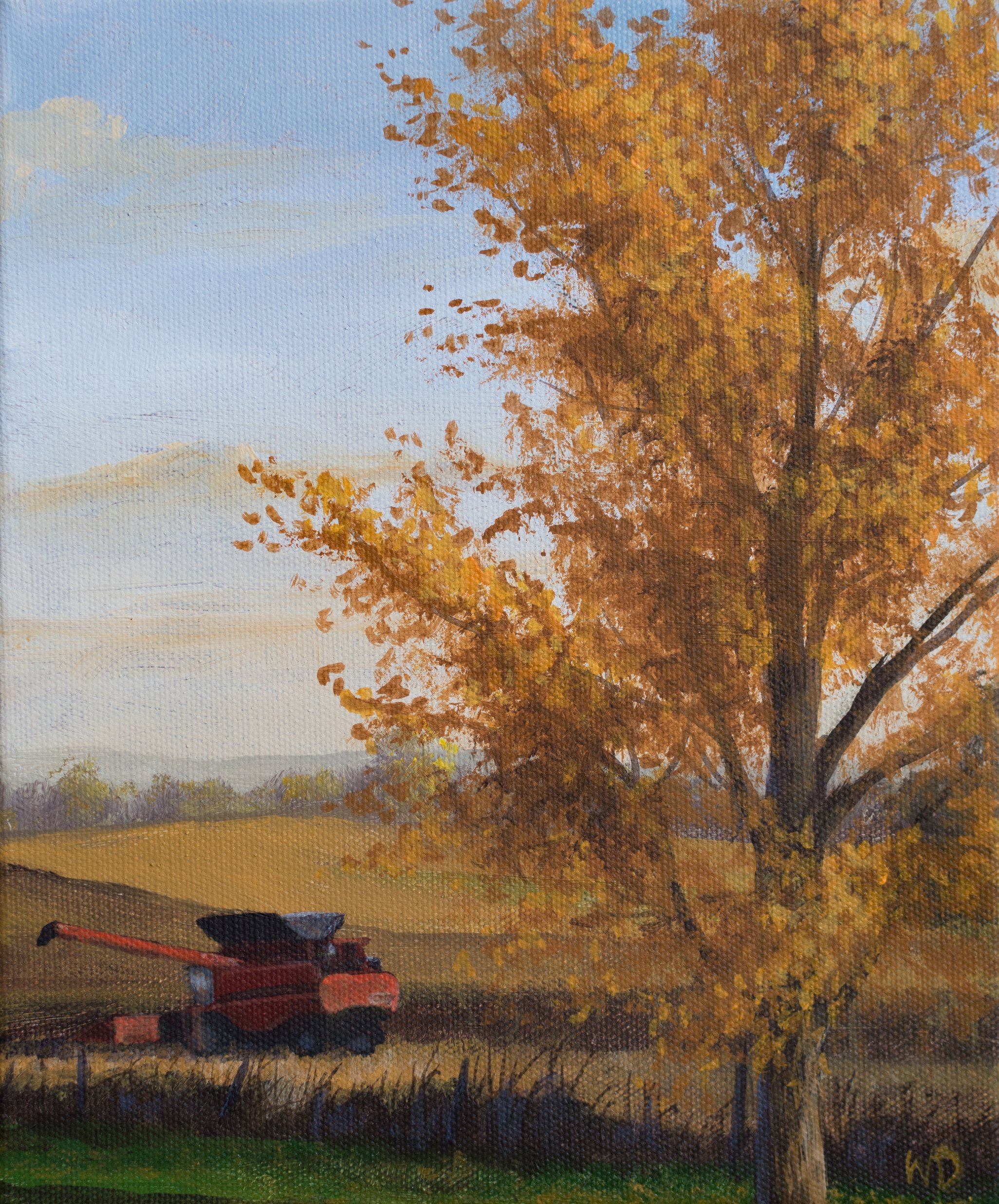 orange fall tree red combine in field