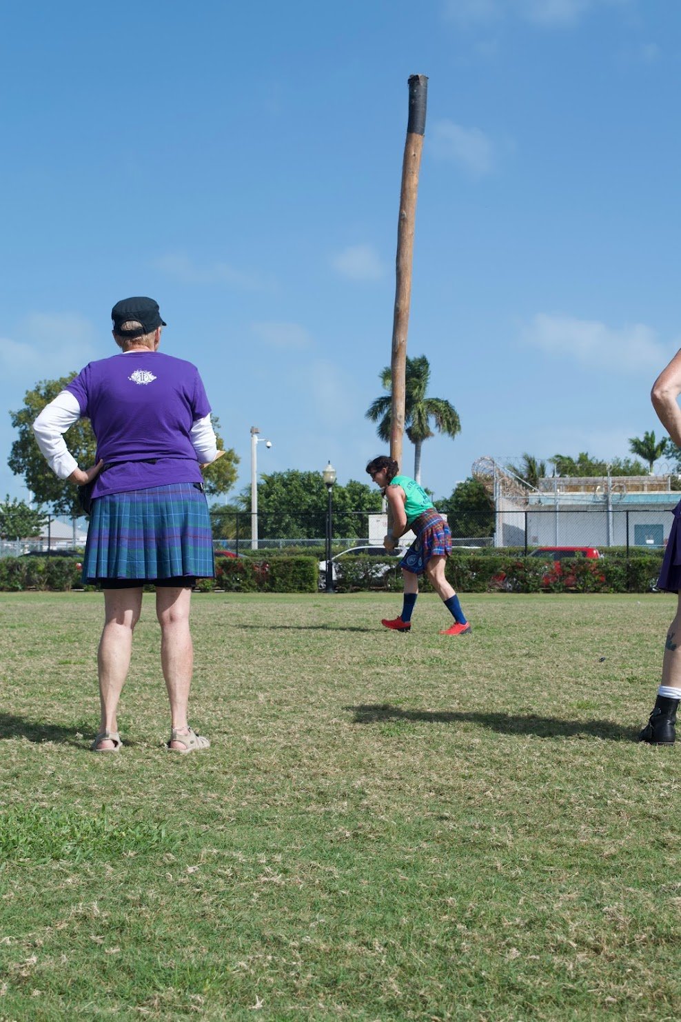 photo of women tossing the Scottish caber at the Florida Keys Celtic Festival.