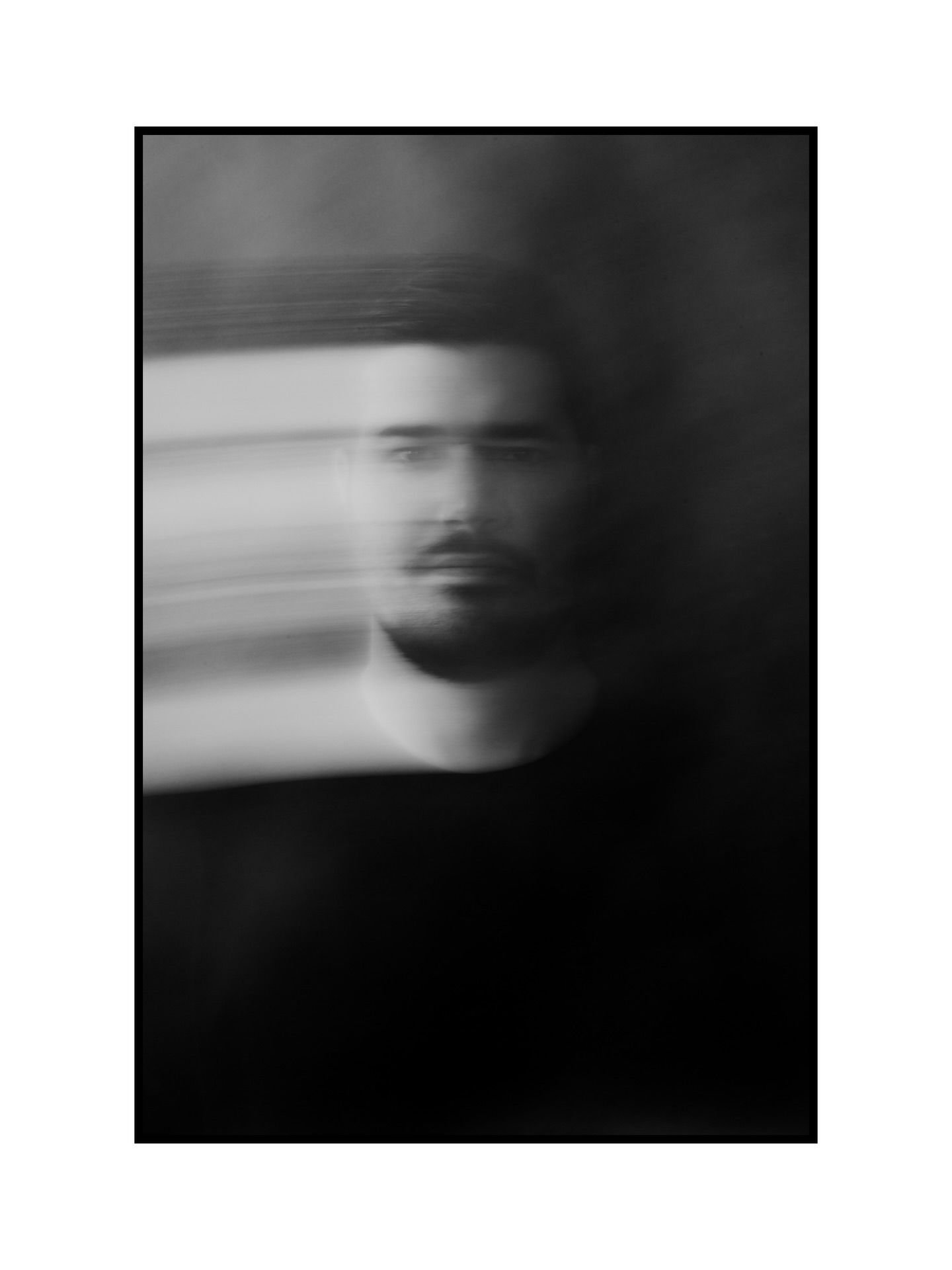 Blurred black and white portrait representing the artistic identity of Carlos Mendes Photography created by Out of Form Studio
