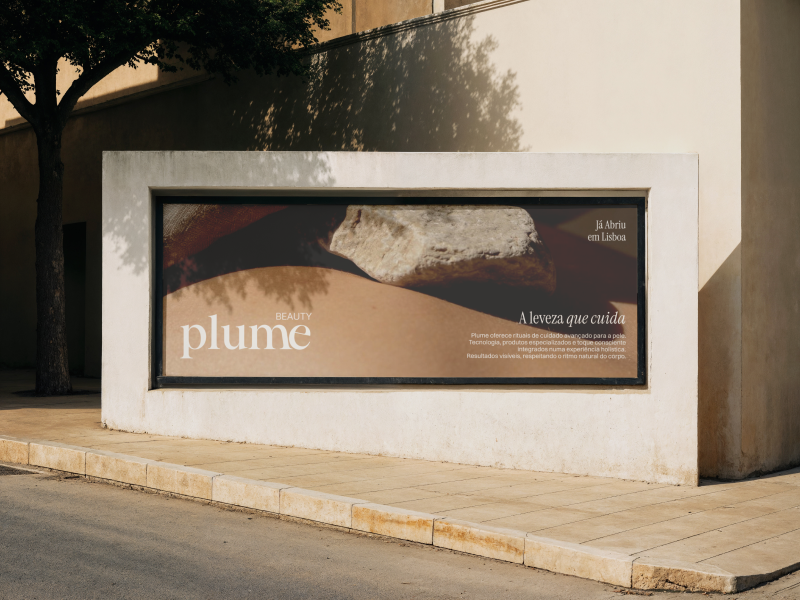 Plume Beauty outdoor advertising mockup featuring the elegant serif wordmark, warm neutral tones and minimalist campaign typography on a large street-level billboard.