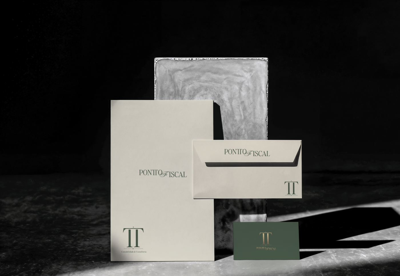 Pontto Fiscal corporate stationery design featuring cream branded folders, a matching envelope, and a dark green business card with a gold TT monogram. Visual identity by Out of Form Studio.