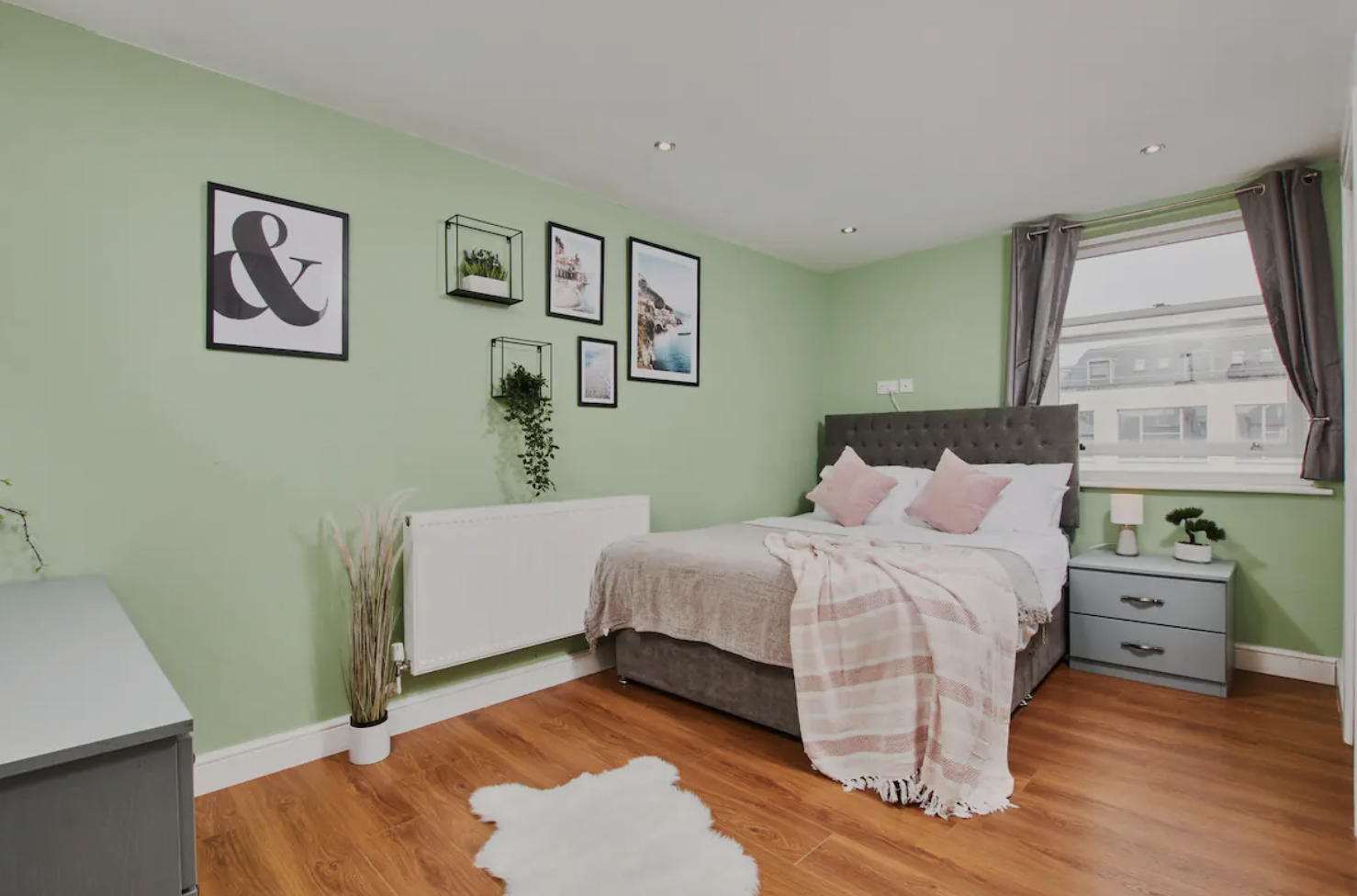 Guest-ready bedroom with natural light and tidy styling, supporting strong short-let reviews