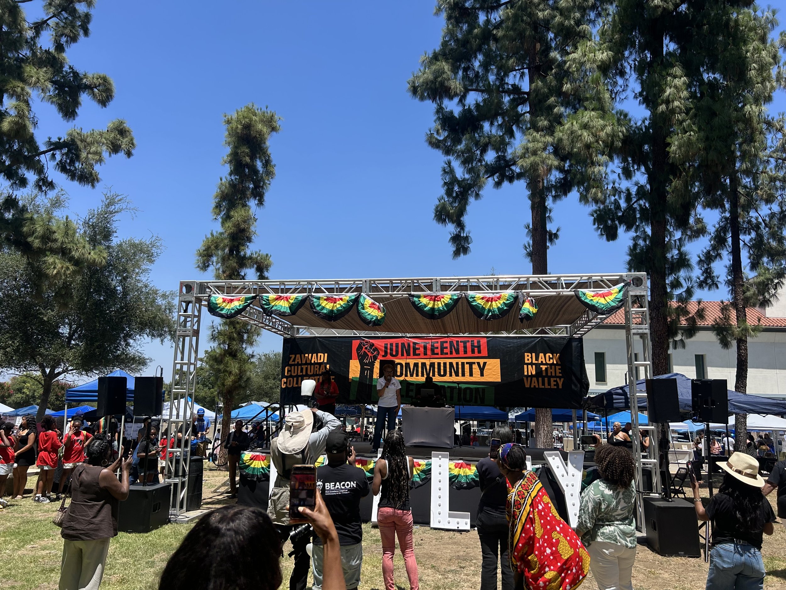 Professional outdoor stage, truss structure, shade canopy, and audio system installed by T-REV PRO for the Juneteenth Community Celebration in Woodland Hills, California.