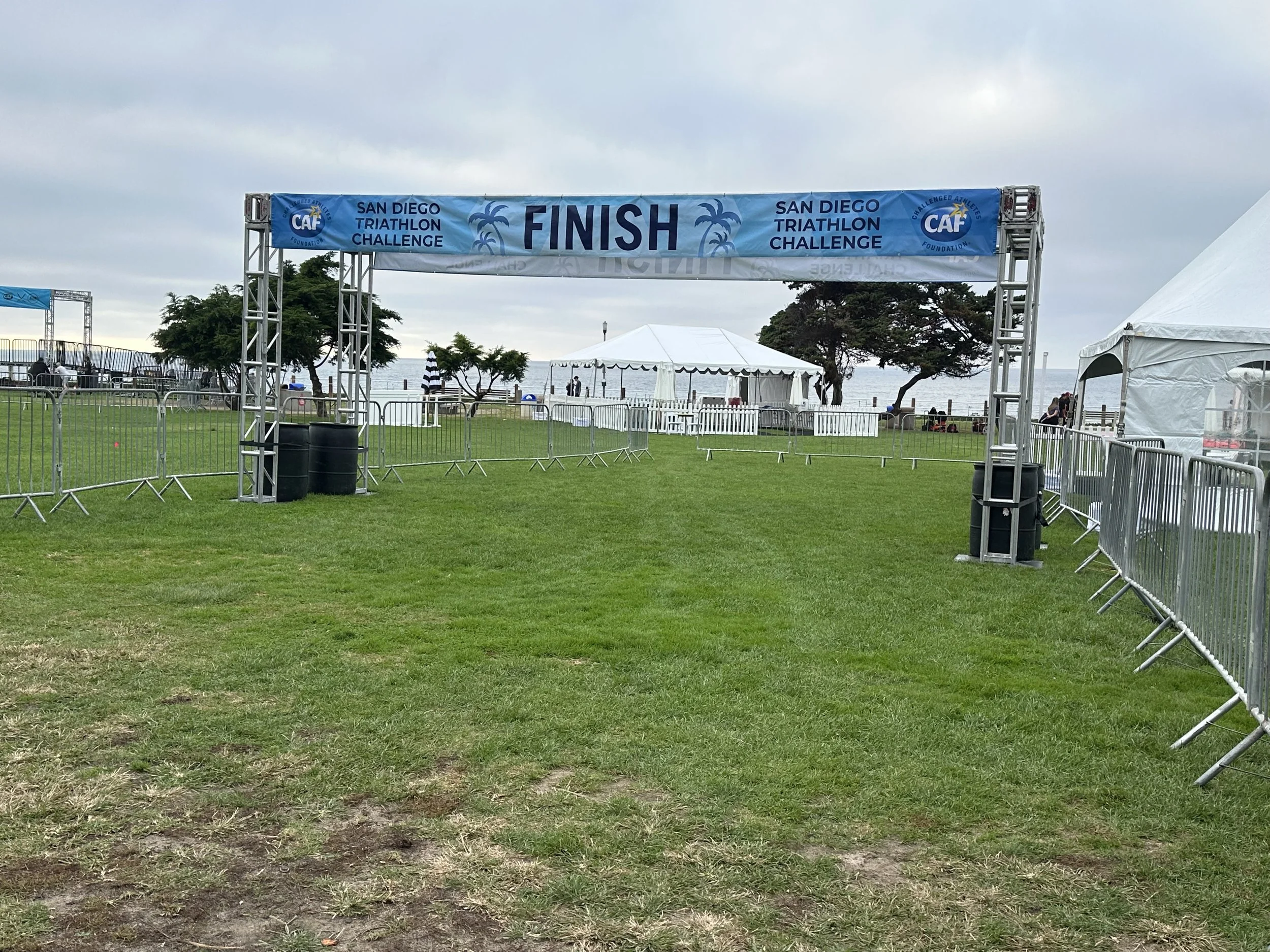 Triathlon finish line truss with branded banner installed for an outdoor race event in San Diego, Los Angeles, and Las Vegas