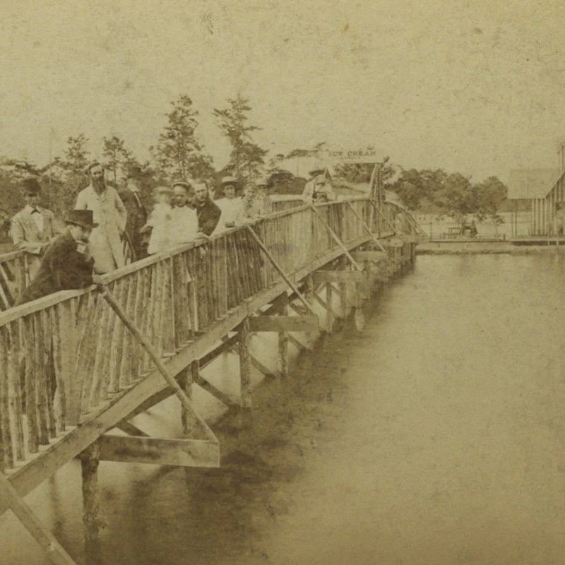 Rustic Bridge (1880)  Temporary wooden bridges were installed to provide a safer and more efficient way to cross Wesley Lake—especially during the off-season and while permanent iron bridges were delayed—because the earlier ferries had limited capaci