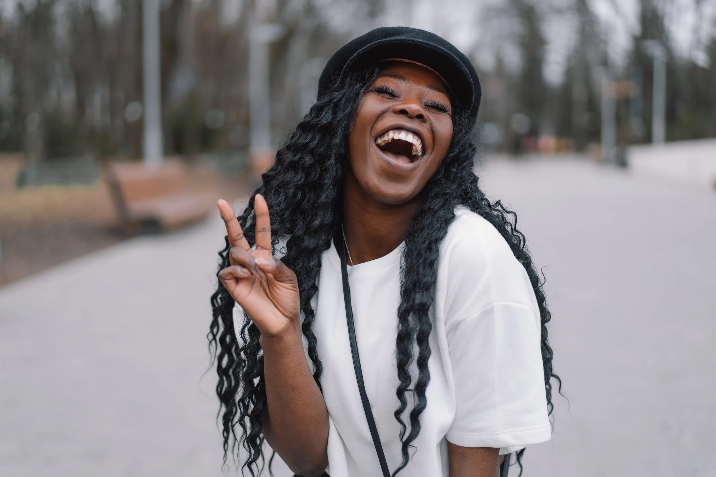 photo-portrait-cheerful-black-skinned-girl-city-park.jpg