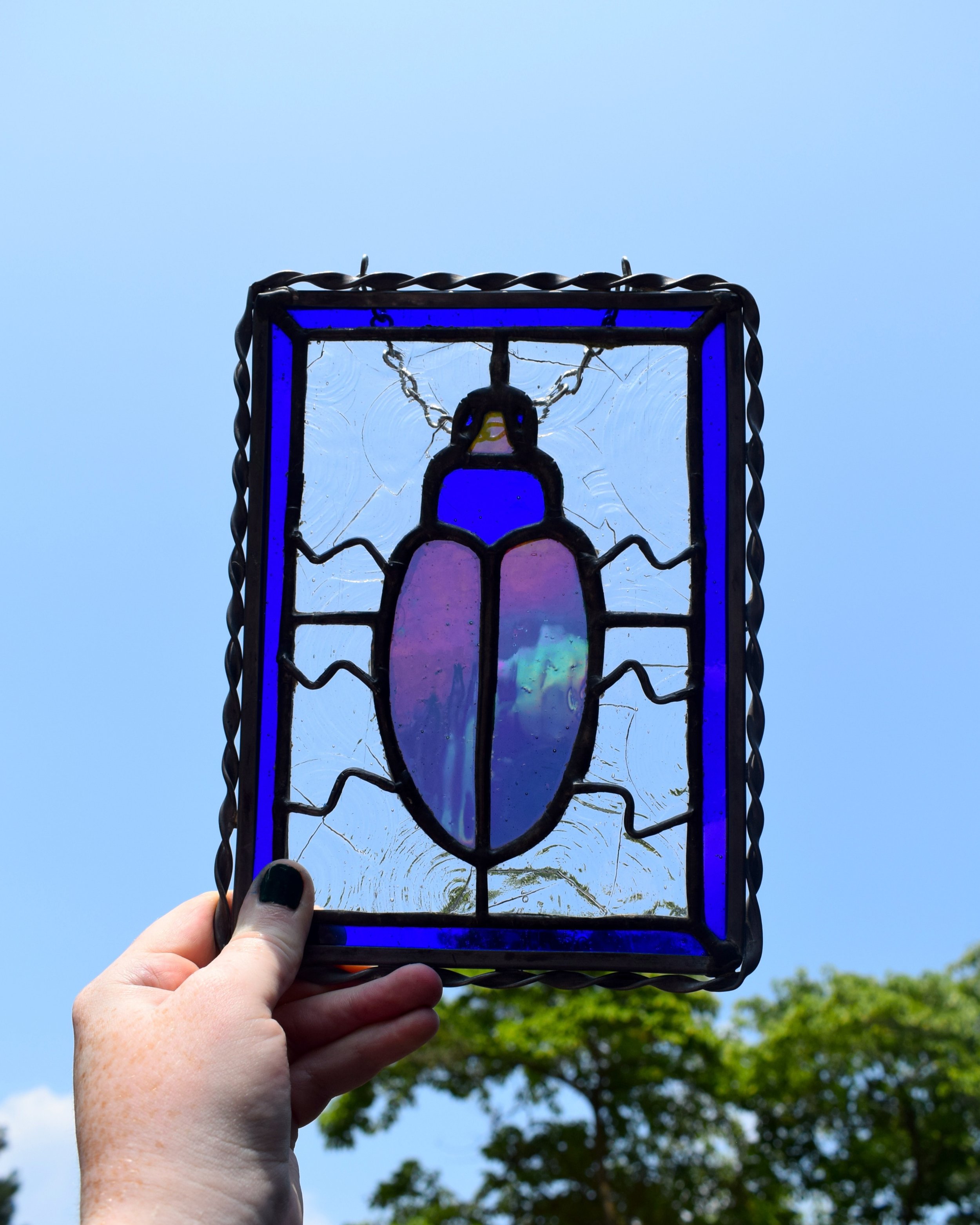 One of my favorite types of glass is iridized - because of the way it changes every time you look at it. I feel like it's so perfect for beetles and bugs, as their shell often has a similar effect (: 

- Available online 
www.blackbirdswindow.com

#s