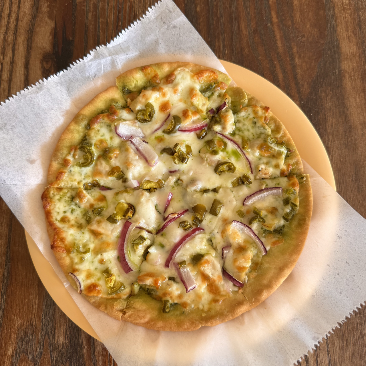 Pita Pizza with Pesto, Chicken, Onion, and Jalapeños