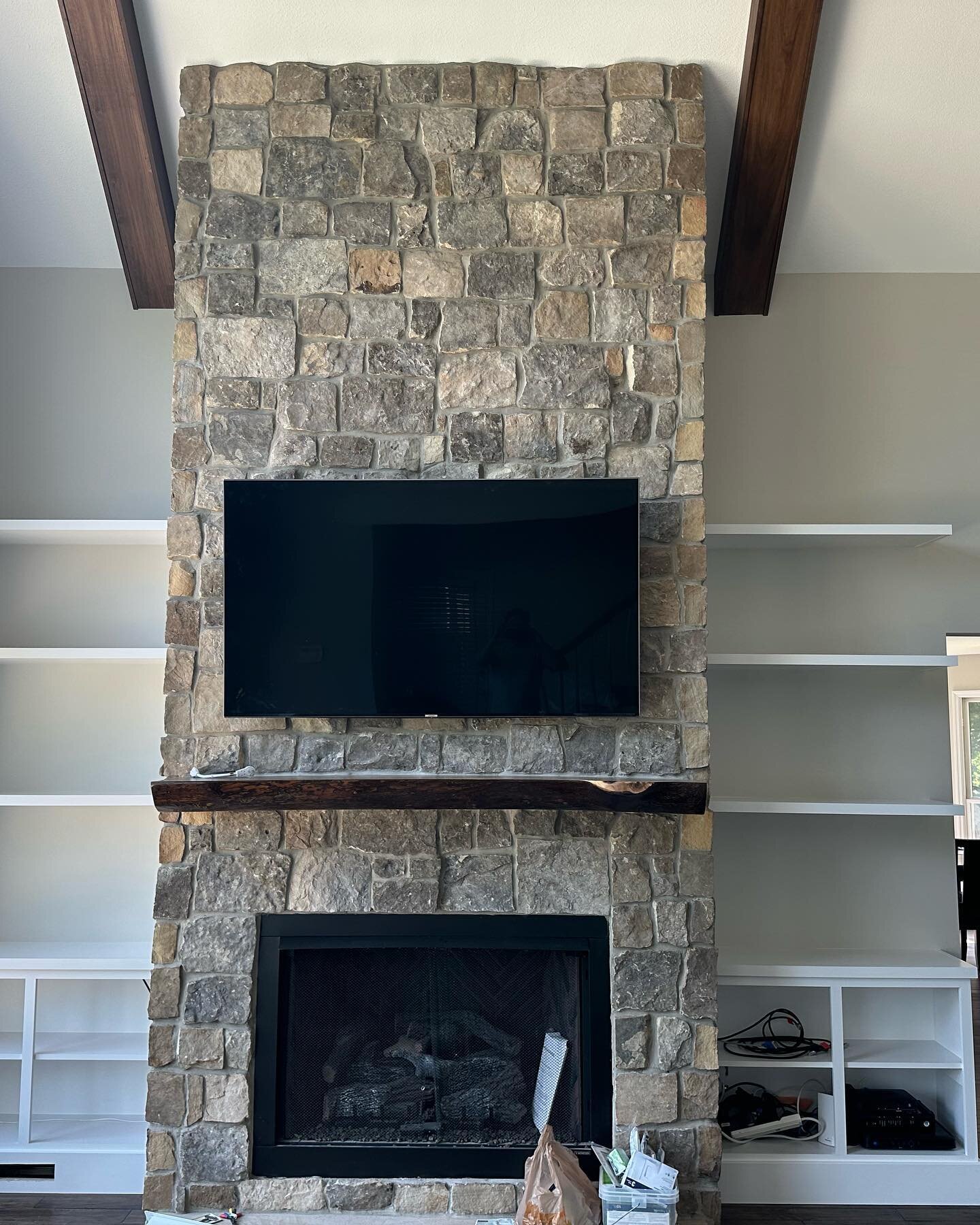 Amazing living room completed! Stained the newly installed beams and painted the ceiling, trim and walls of course. Btw, that gorgeous stone fireplace wasn&rsquo;t there when the project began. Amazing addition!