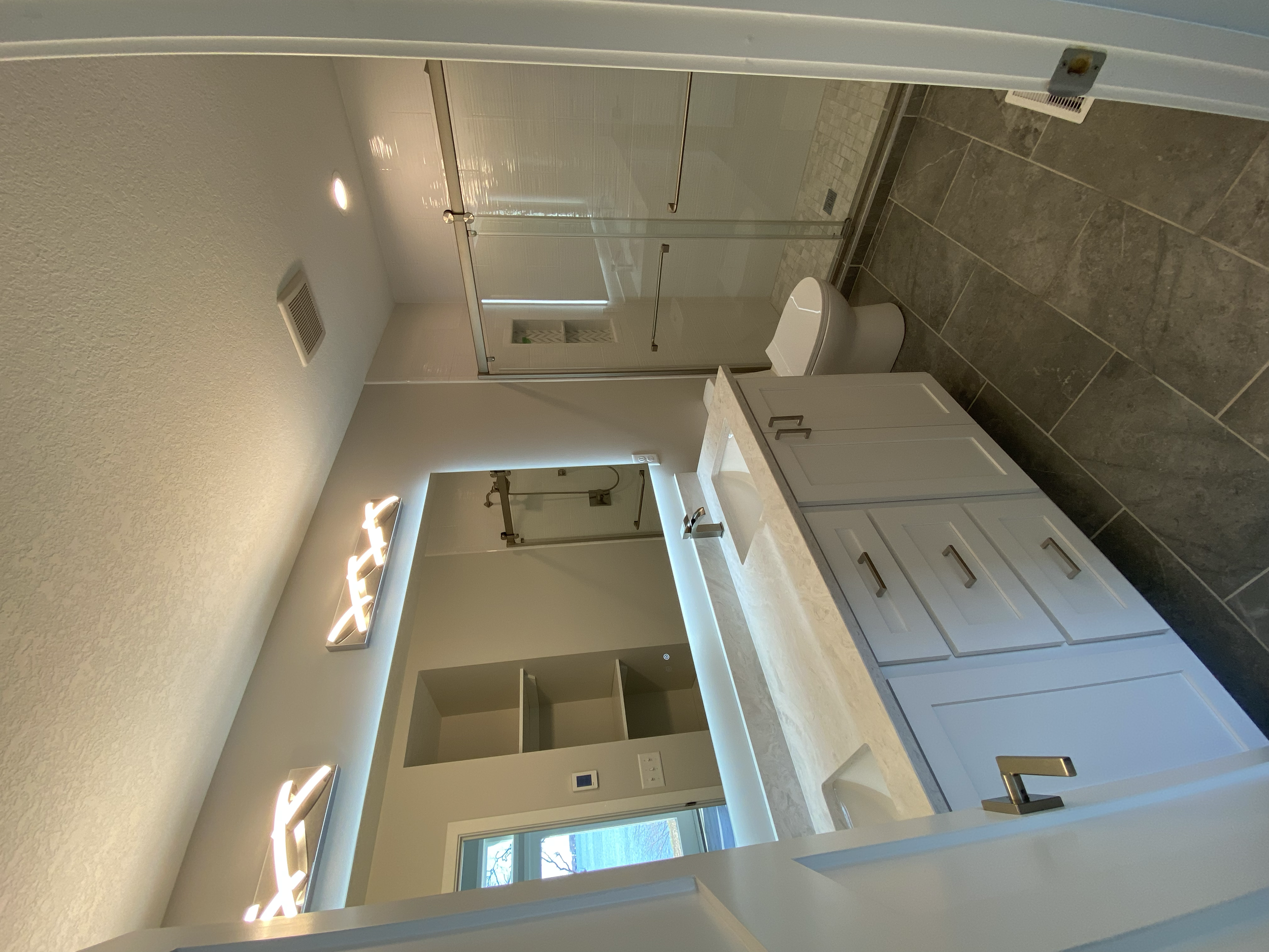 Master ensuite with double vanity and tiled shower. 