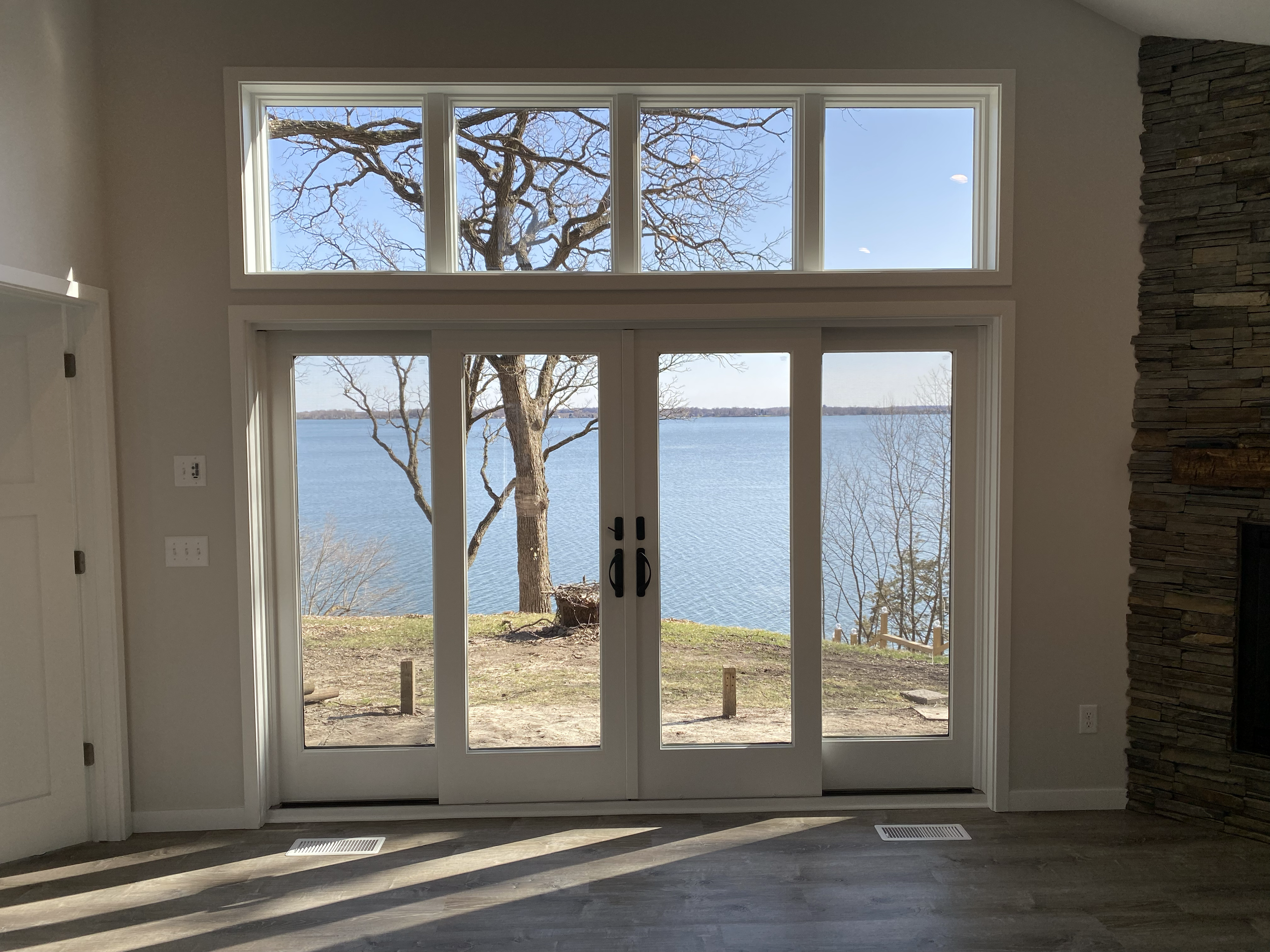 Breathtaking views right from the living room overlooking the lake. 