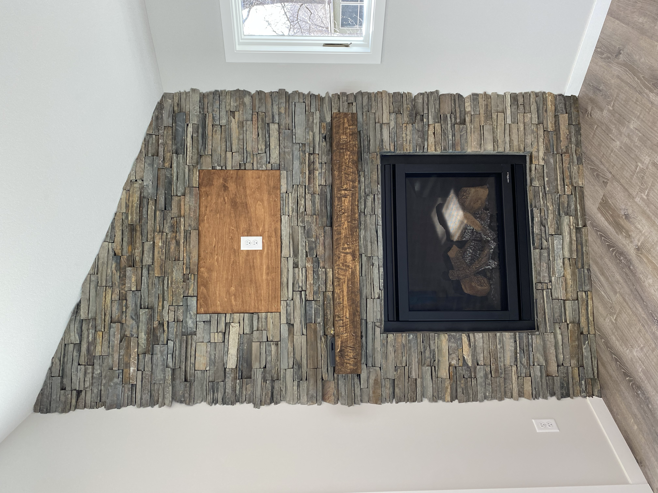 Beautiful stone and mantle to accent the new gas fireplace. 