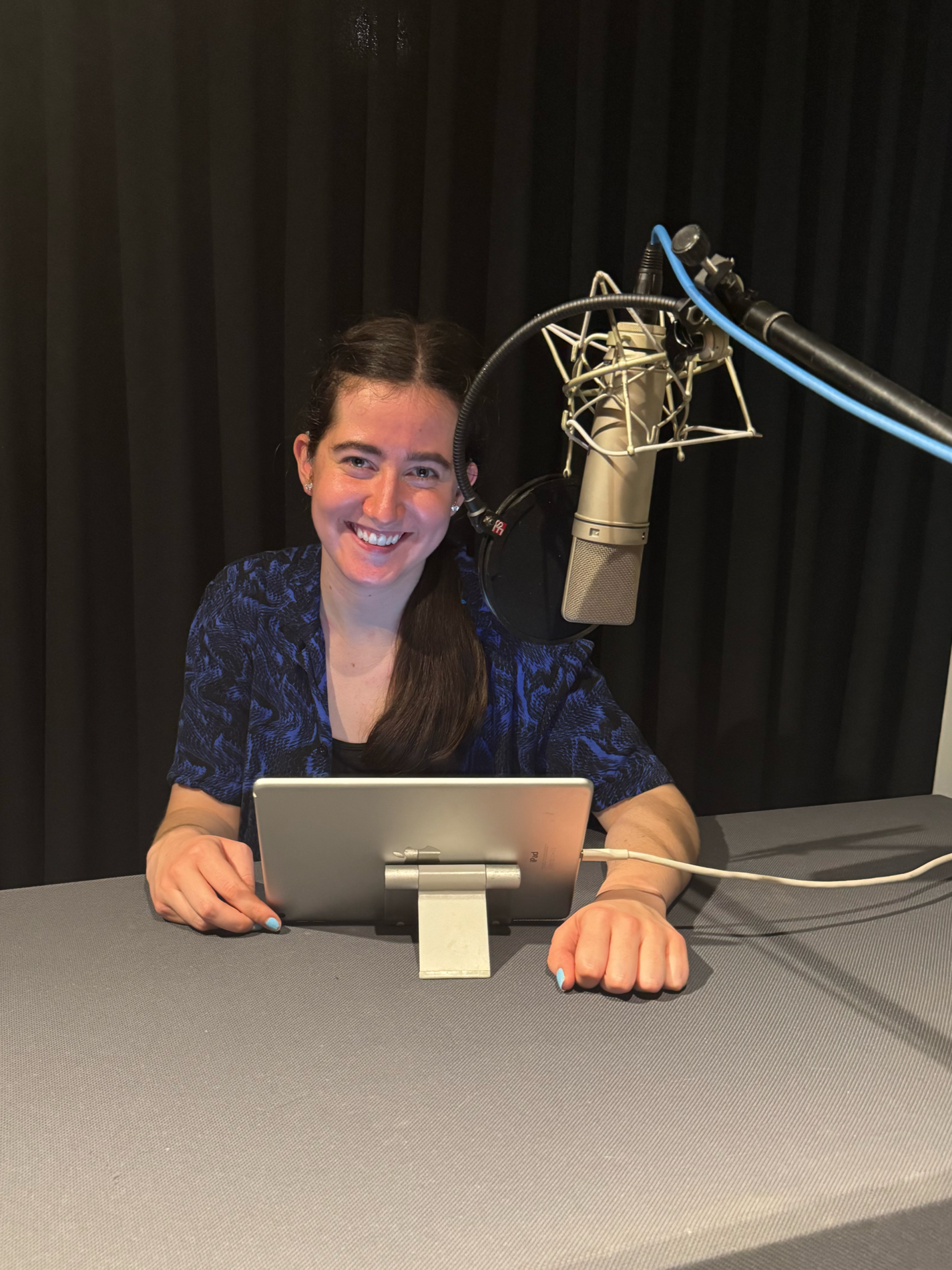 Erin in the recording studio working on narrating the audiobook for the YA novel "Someone to Daydream About" by Sydney Langford