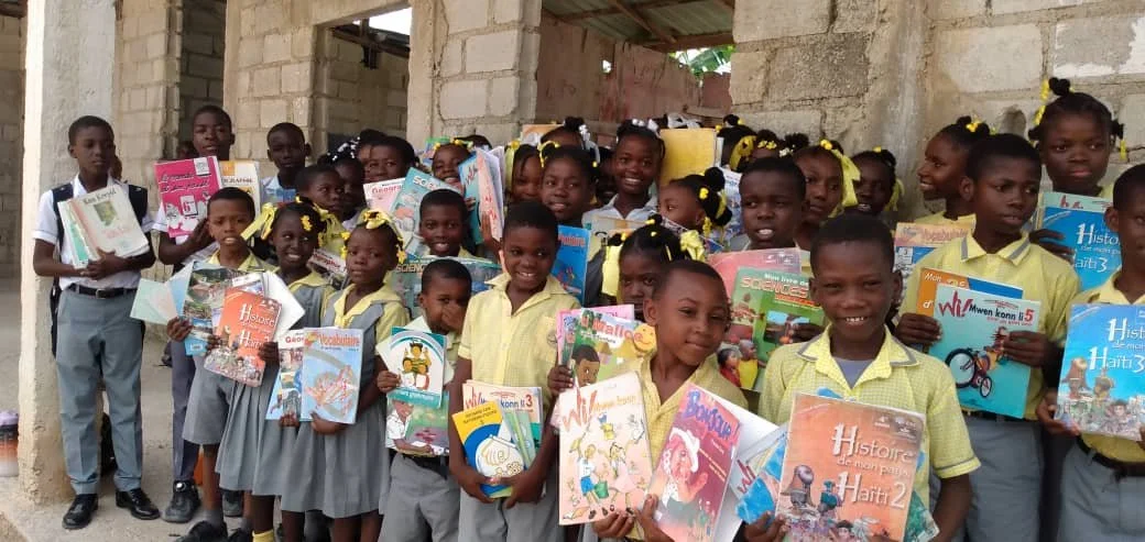 children in haiti with books