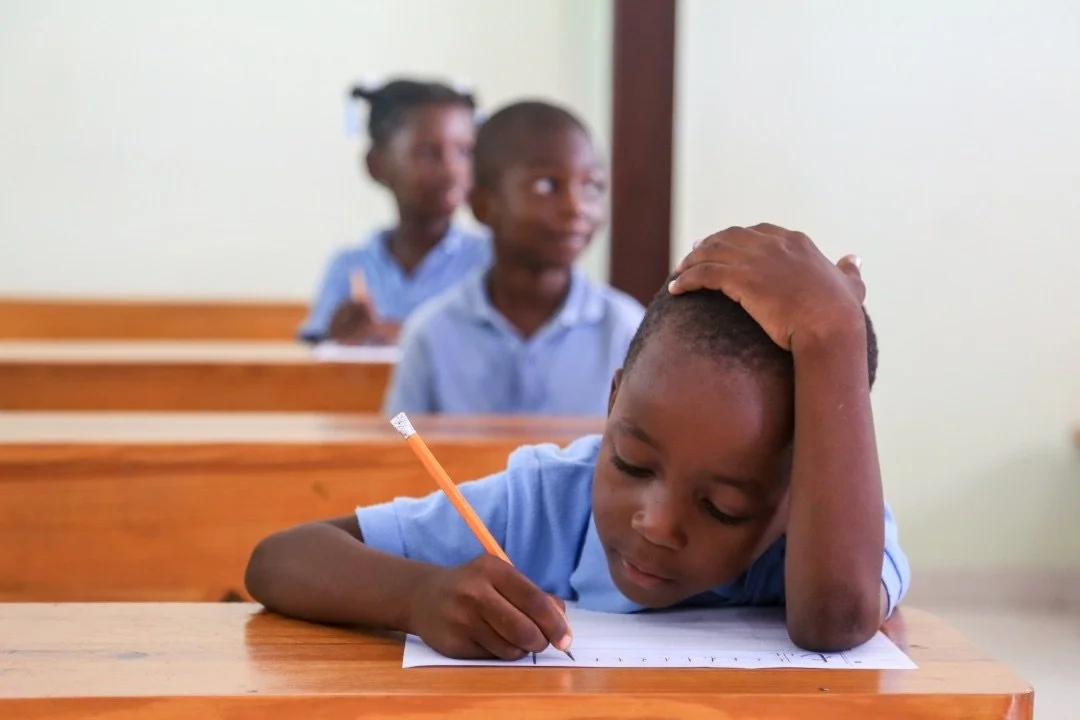 student in Haiti learning