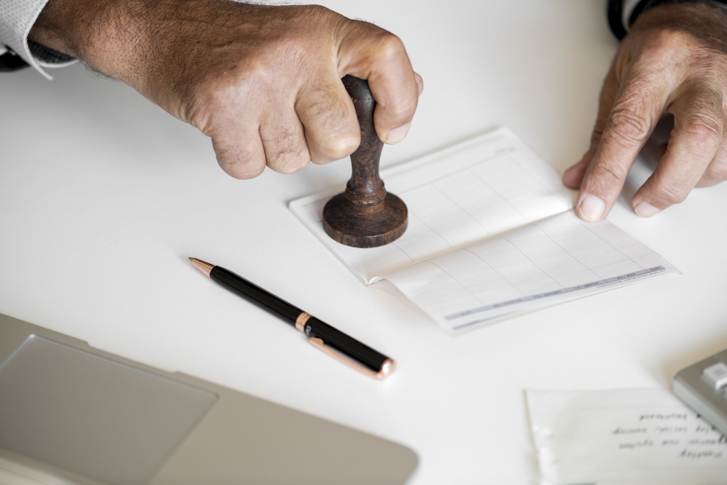 people-checking-bankbook-isolated-white-table.jpeg
