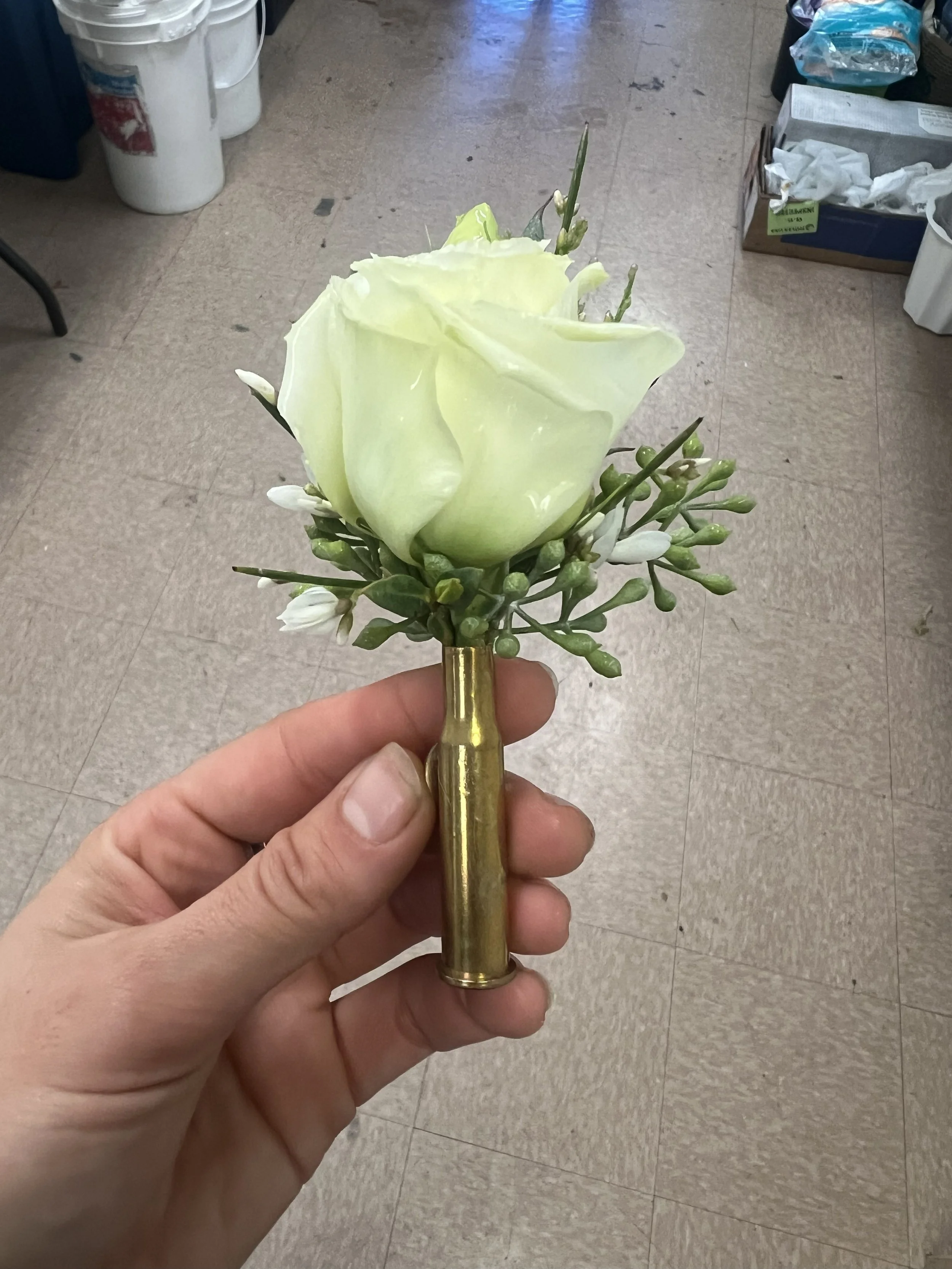 Front Street boutonnière made from a bullet casing, so Texas