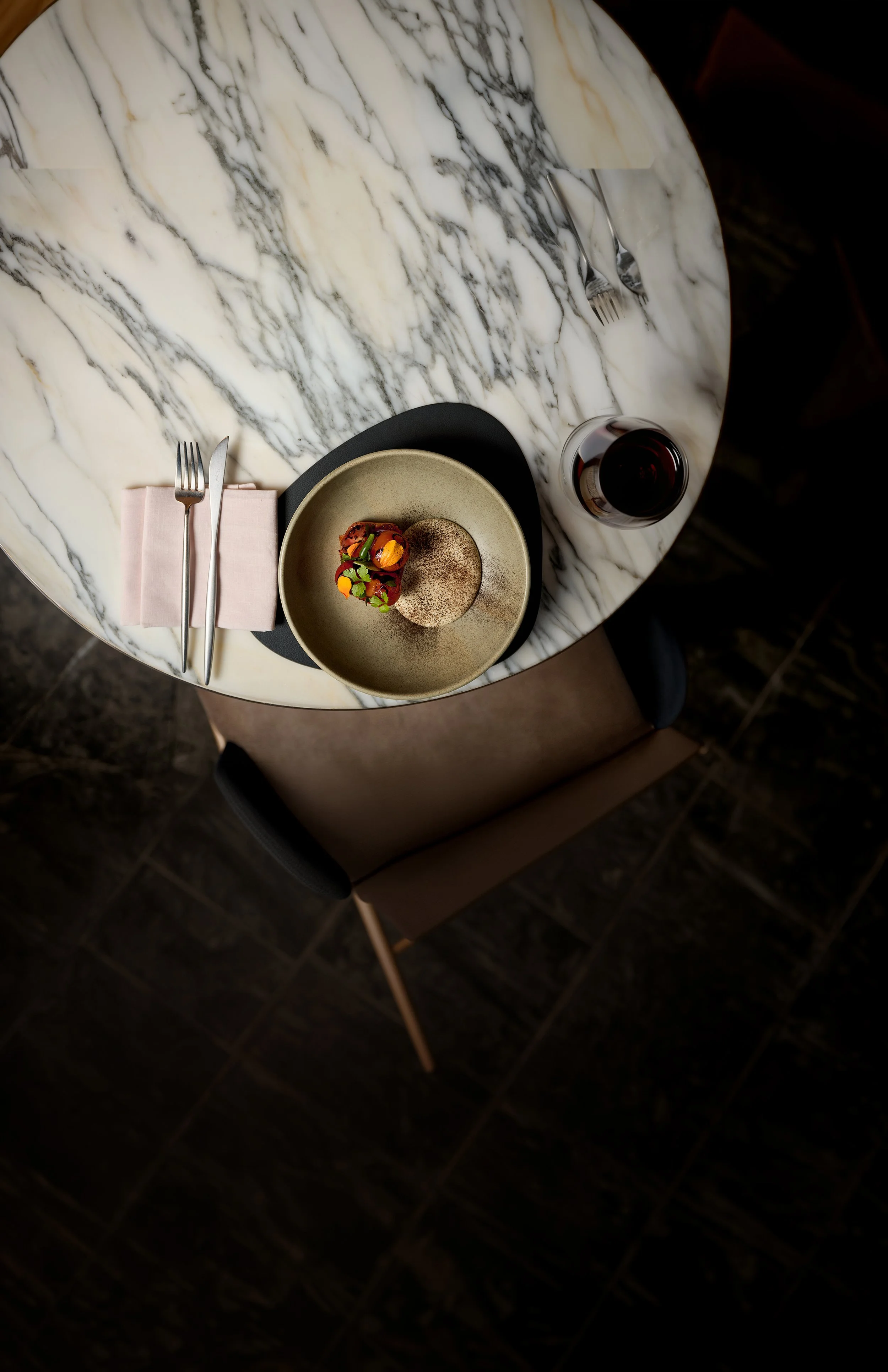 Marble table with a plate of meat and creamed mash