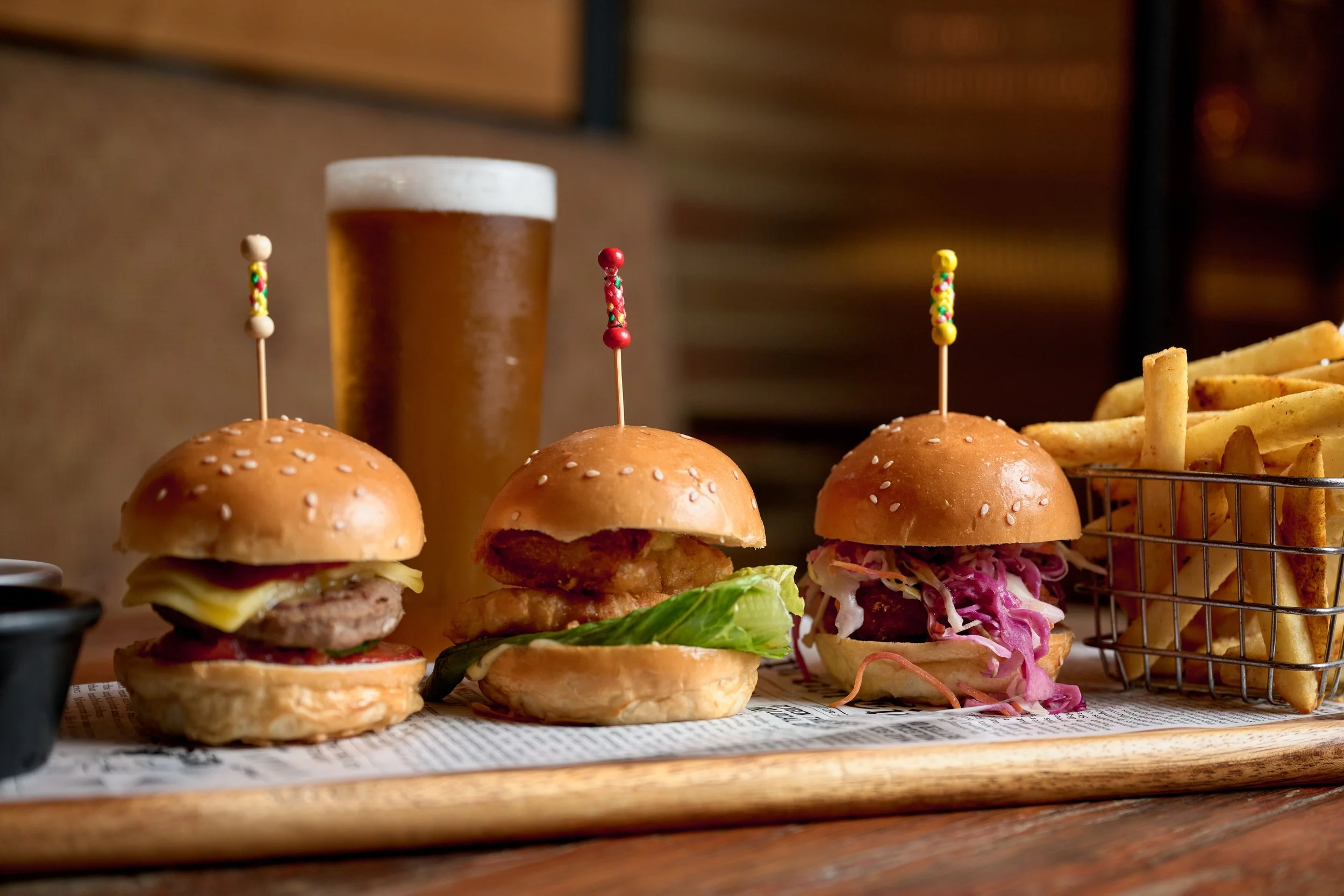 Slider burgers, chips and a glass of beer
