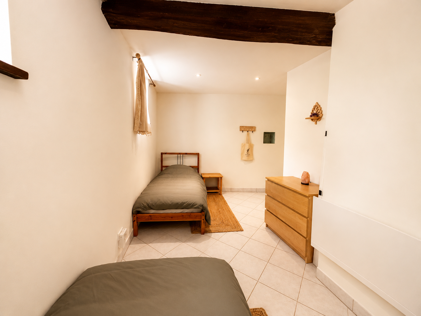 The Hearth Room — shared twin ensuite bedroom at the Beneath the Noise retreat