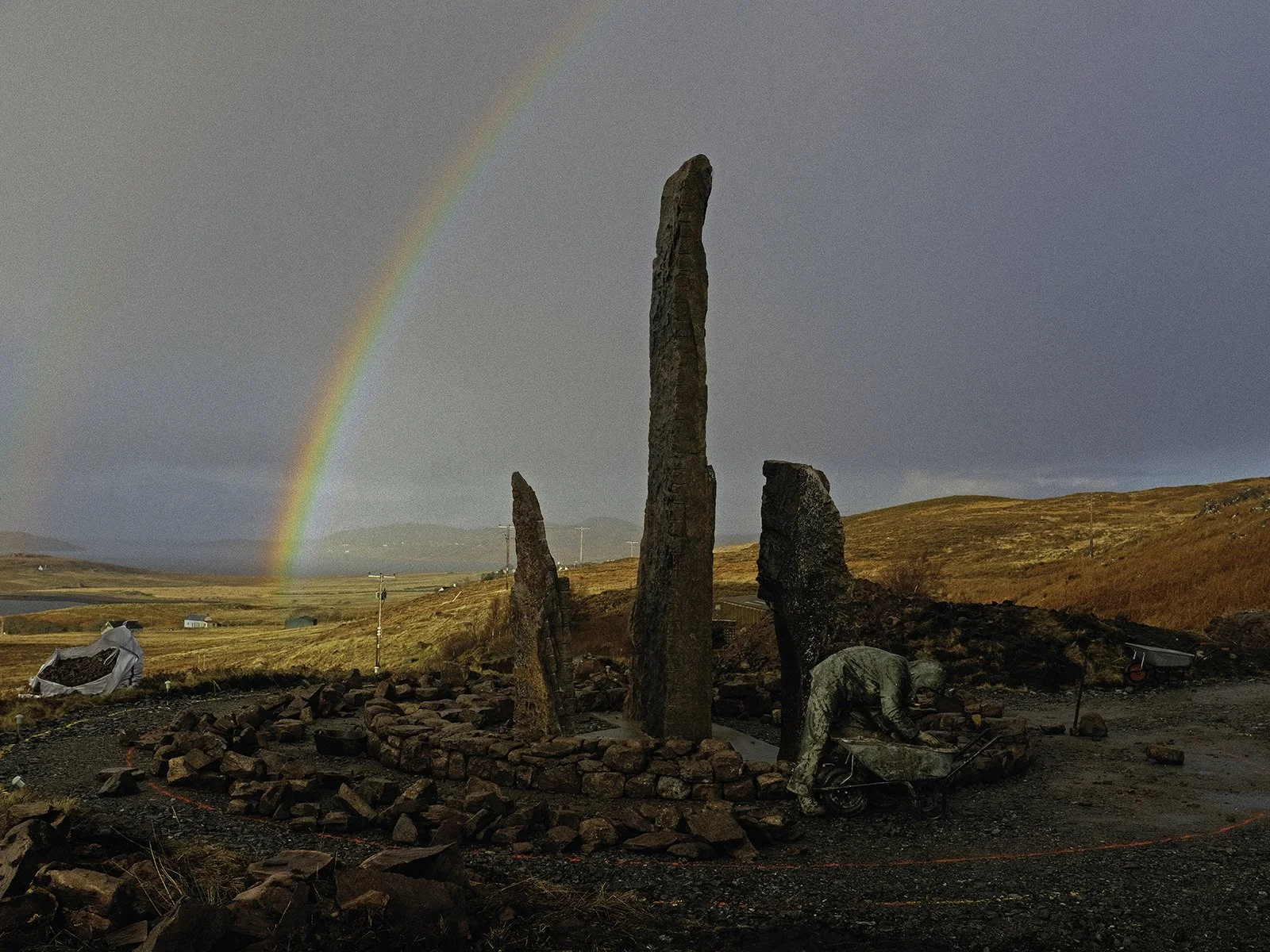 Drystone wallers from Wildland Services work on the circular wall construction in all weathers.