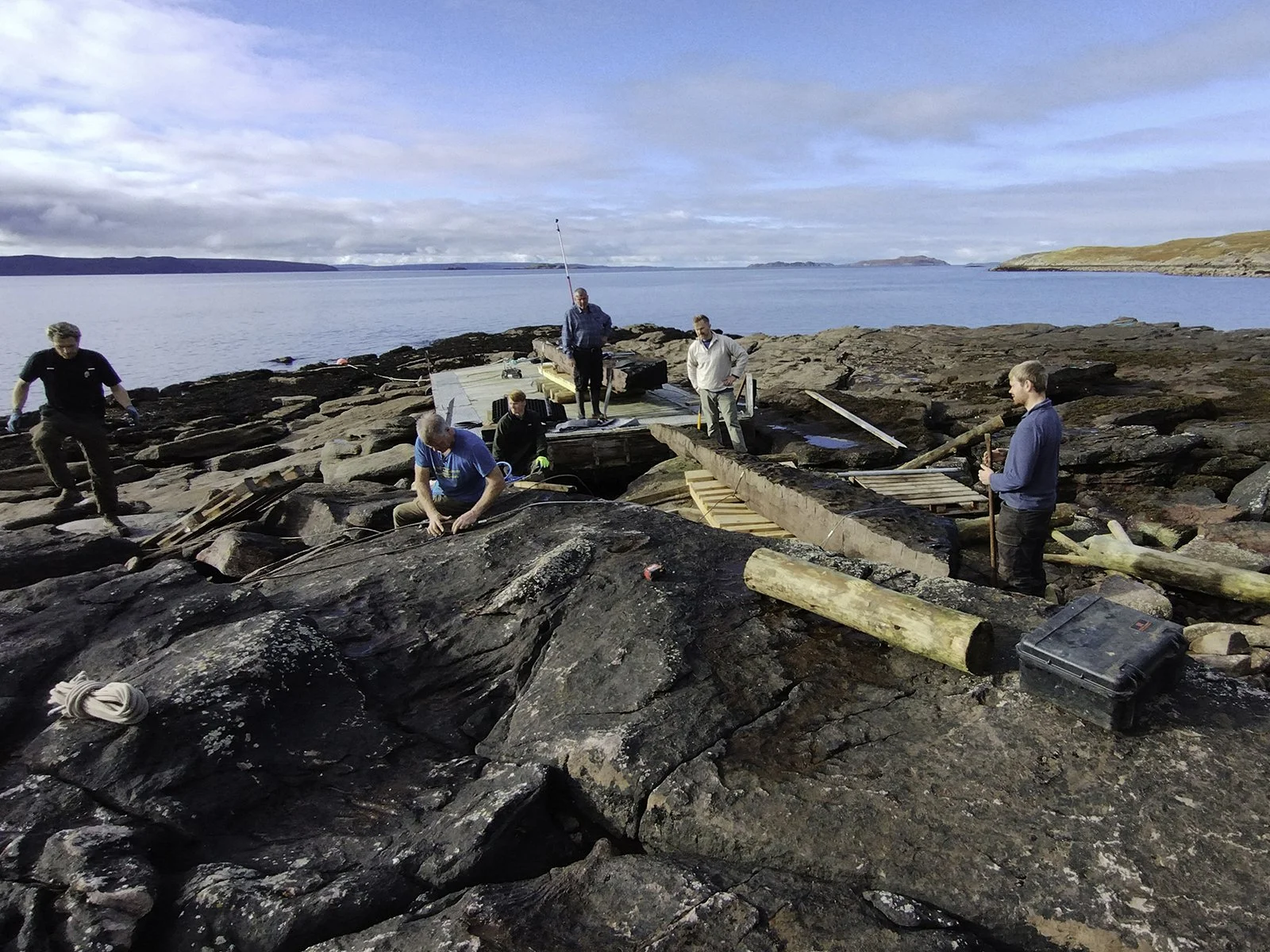Moving the stones onto the raft.