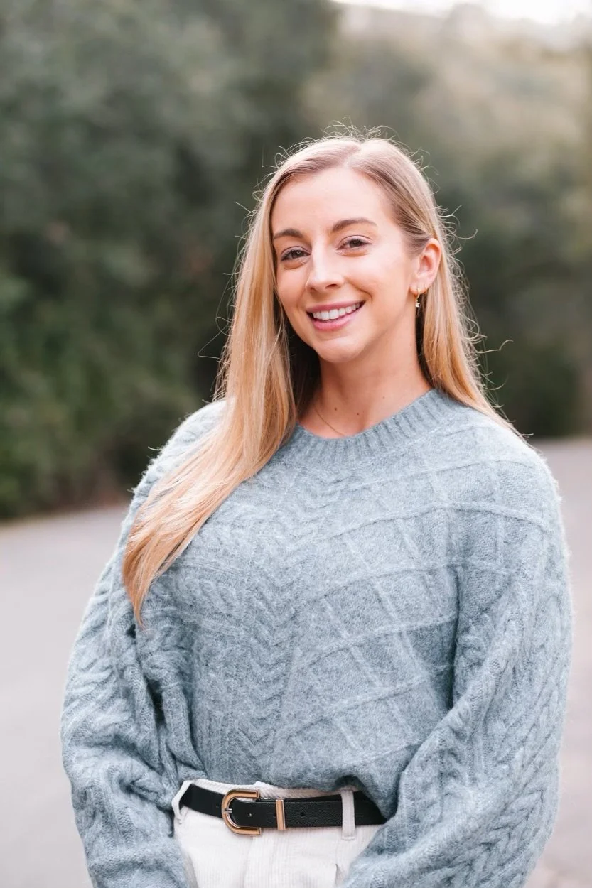 Dr. Allea Francis wearing professional clothing and smiling