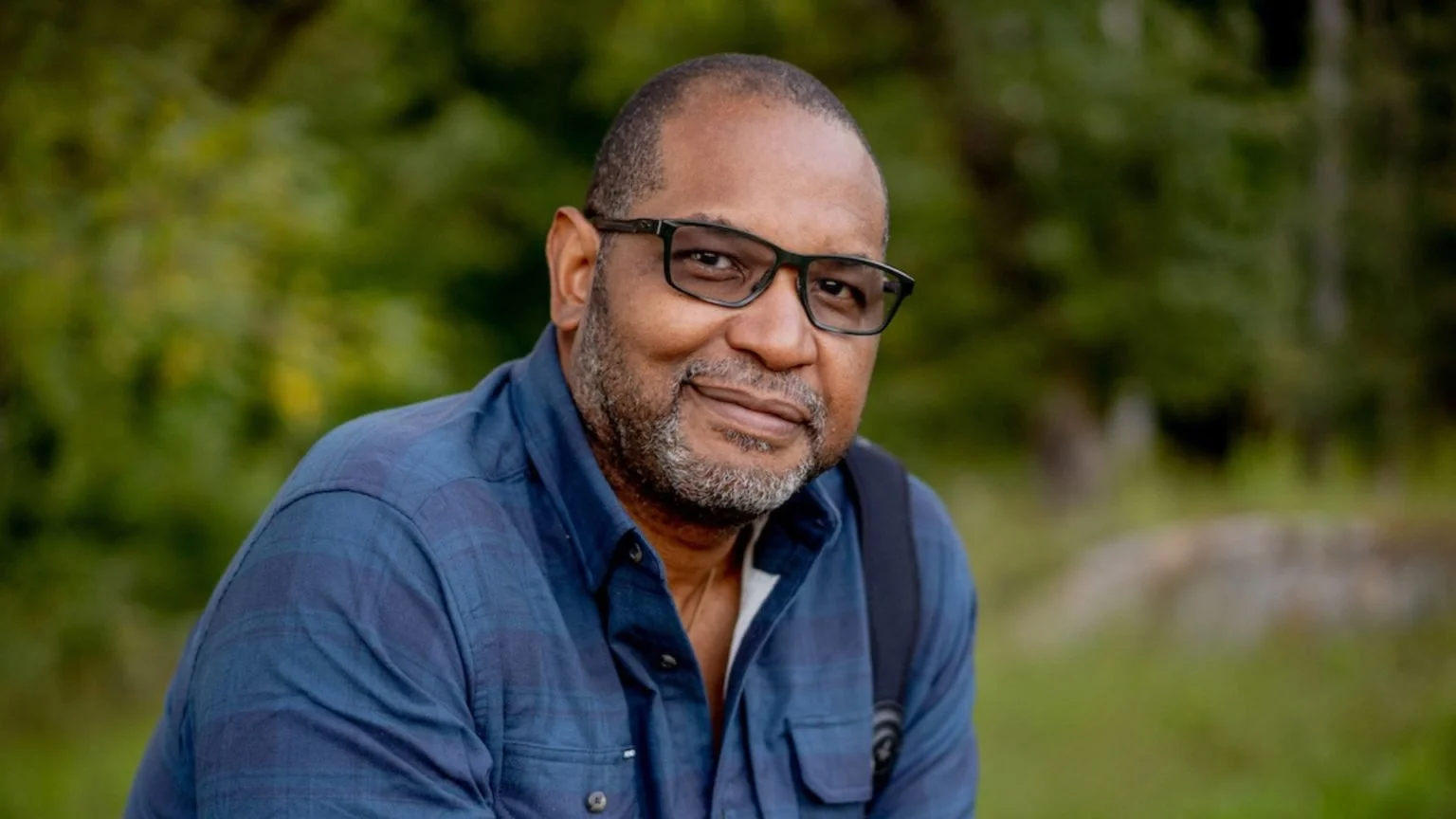 J. Drew Lanham smiling with glasses on