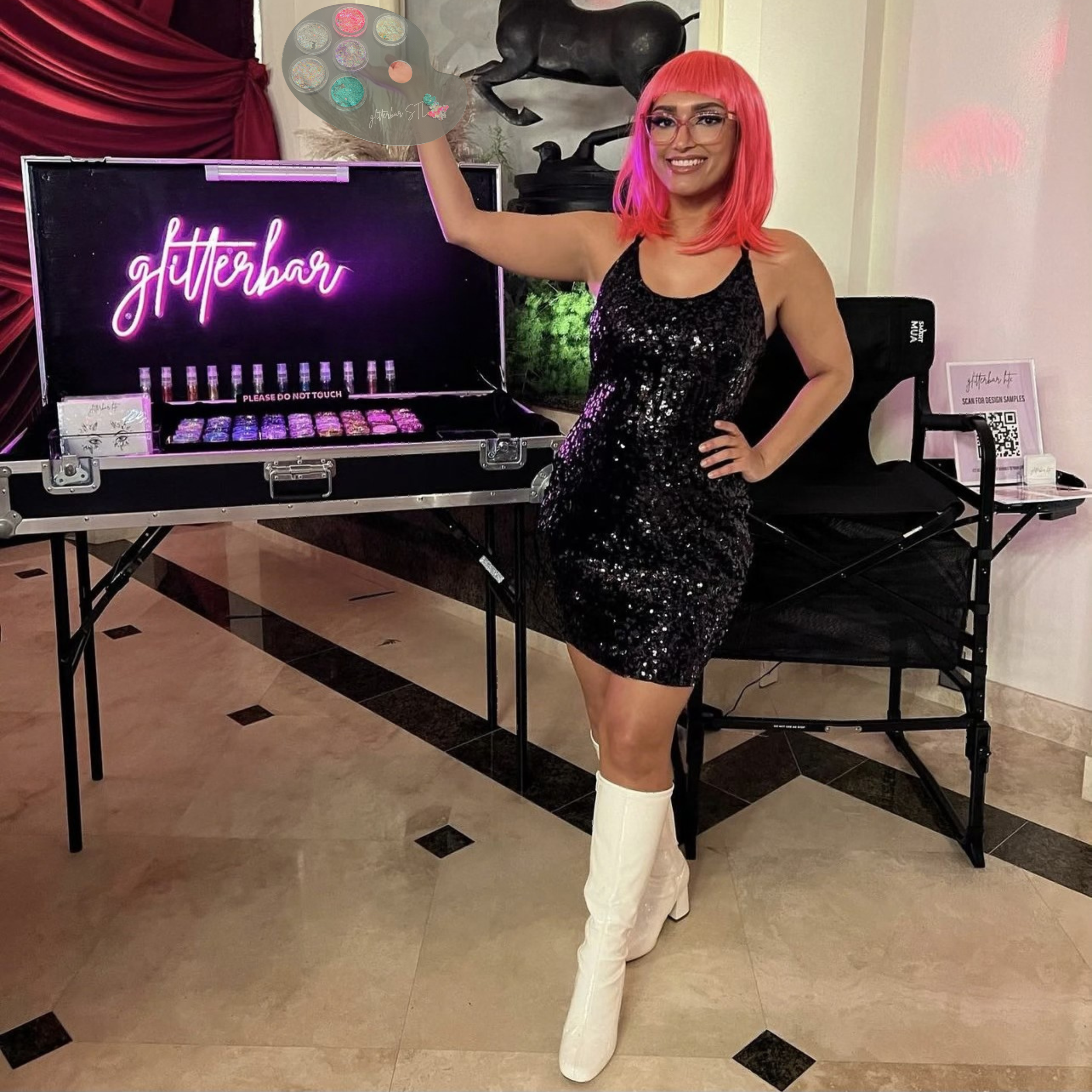Glitterbar STL founder posing in front of branded glitter station at a corporate event.