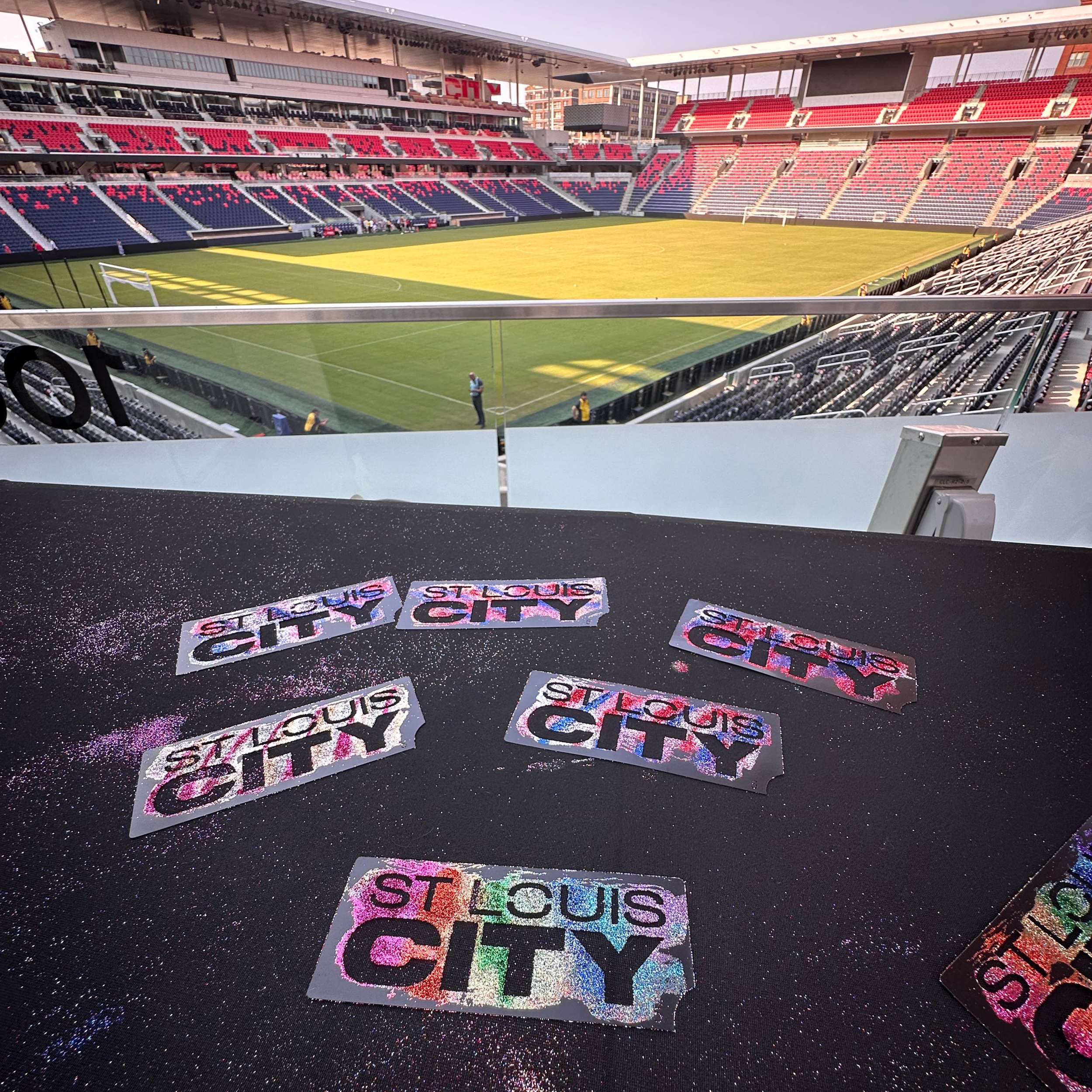 “St. Louis CITY glitter tattoo stencils displayed at a professional sports event activation.