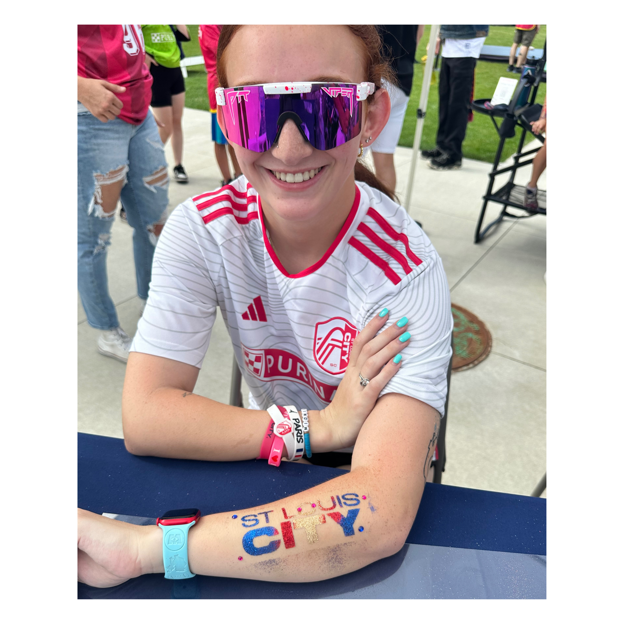 “Event guest showing St. Louis CITY glitter tattoo applied at a stadium activation.”