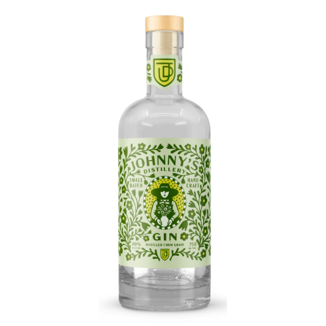 Bottle of Johnny's Distillery gin with green floral label, logo, and wooden cap.