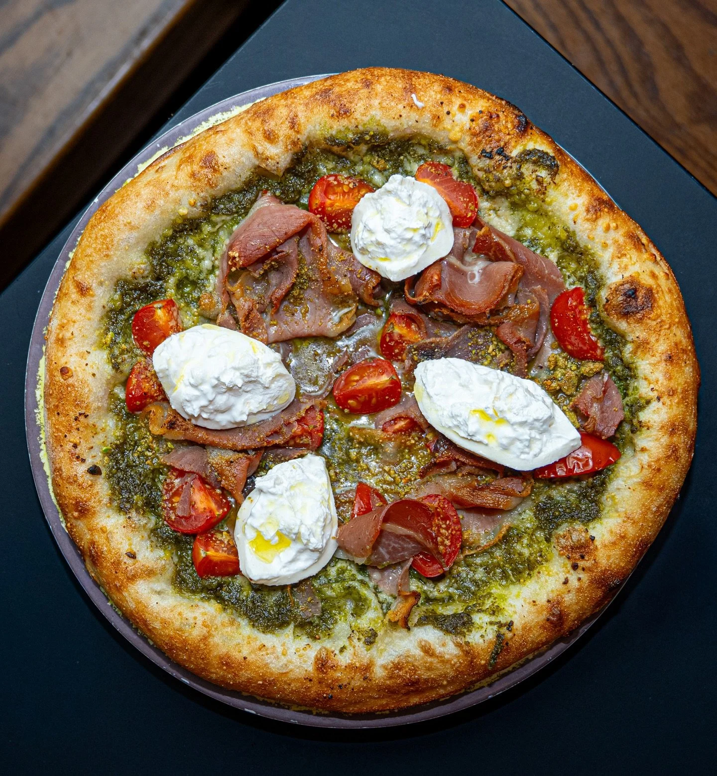 🍕 Pizza Of The Week 🍕

Pizza Pestorata

House pizza dough fermented for 4 days, layered with aromatic pesto base, cherry tomatoes, toasted pistachio, parmesan cheese, indulgent burrata, and delicate prosciutto

It is soooo good! Come try it at Koma
