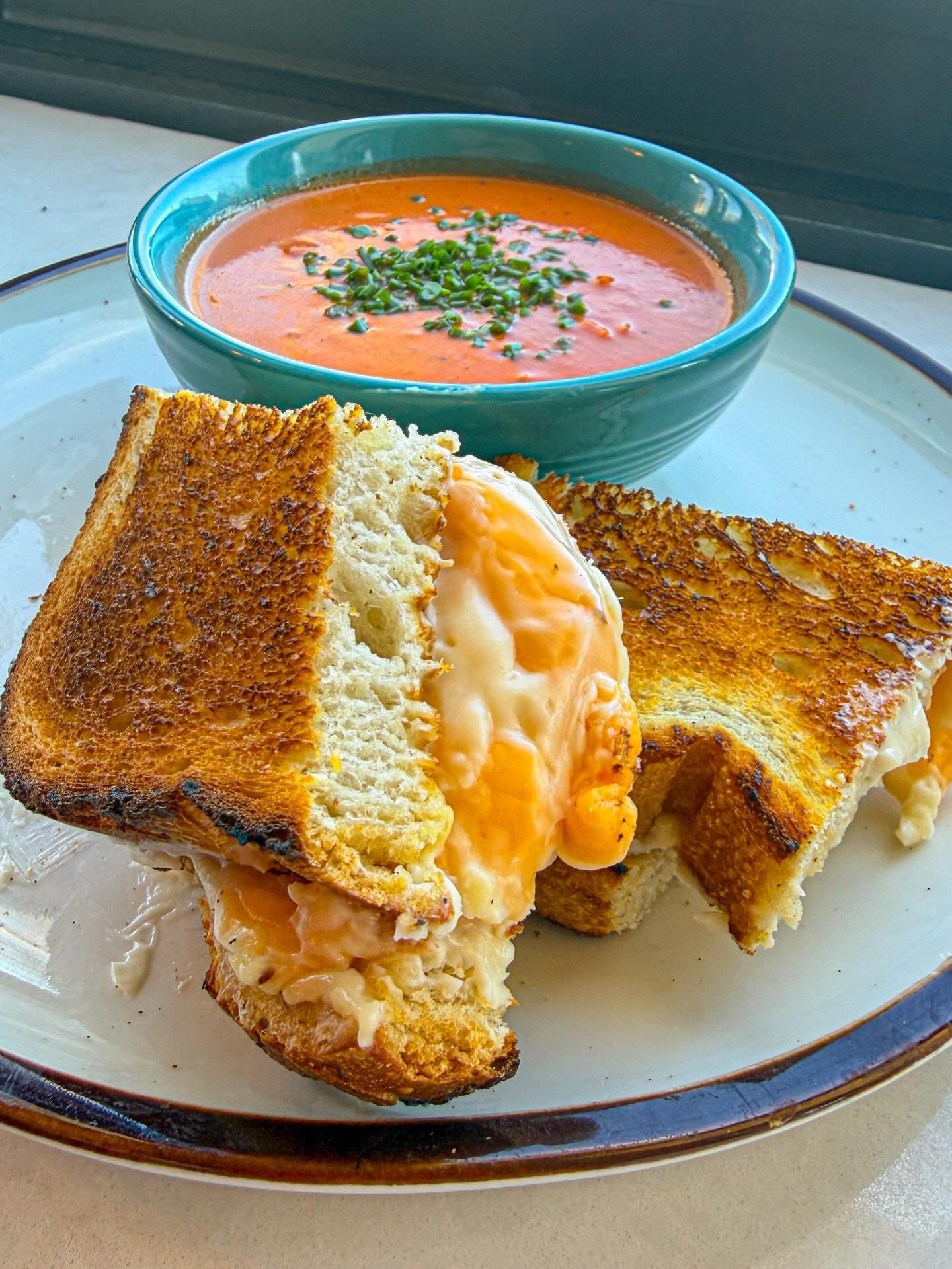 Grilled Cheese + Tomato Soup 

Classic Duo, and the grilled cheese is filled with gooey Brie and American cheese! Just $12! Come get it today at Koma Cafe!