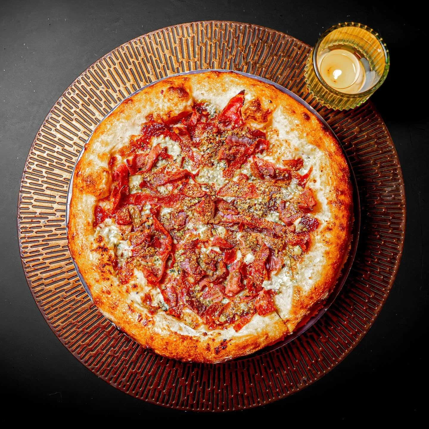 Happy National Pizza Day

The Pig in the Pantry.
Because apparently one pig just wasn&rsquo;t enough.

We took a perfectly innocent pizza and raided the entire charcuterie board like it owed us money. Sweet, sticky caramelized fig onion sauce. Funky 