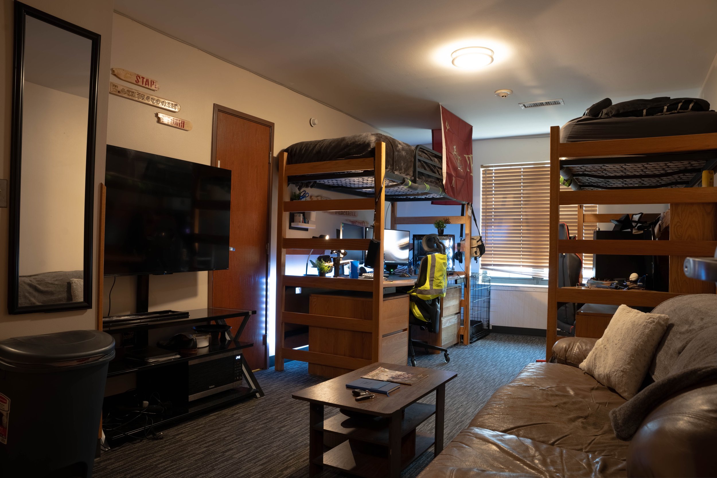New Edition contains suite style living arrangements with 2 men to a room.  The room contains 2 lofted beds, a large desk, a walk-in closet, a couch, and a large dresser.