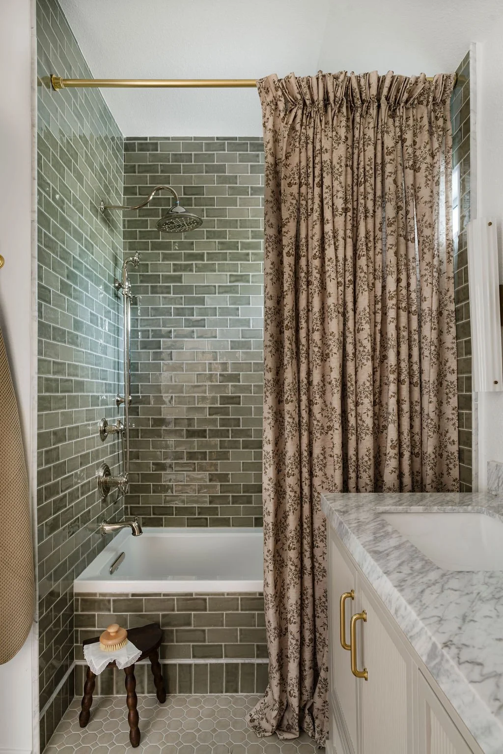 Olive green ceramic tile at Primary Bathroom Remodel South Austin by Iris & Ivy Interiors