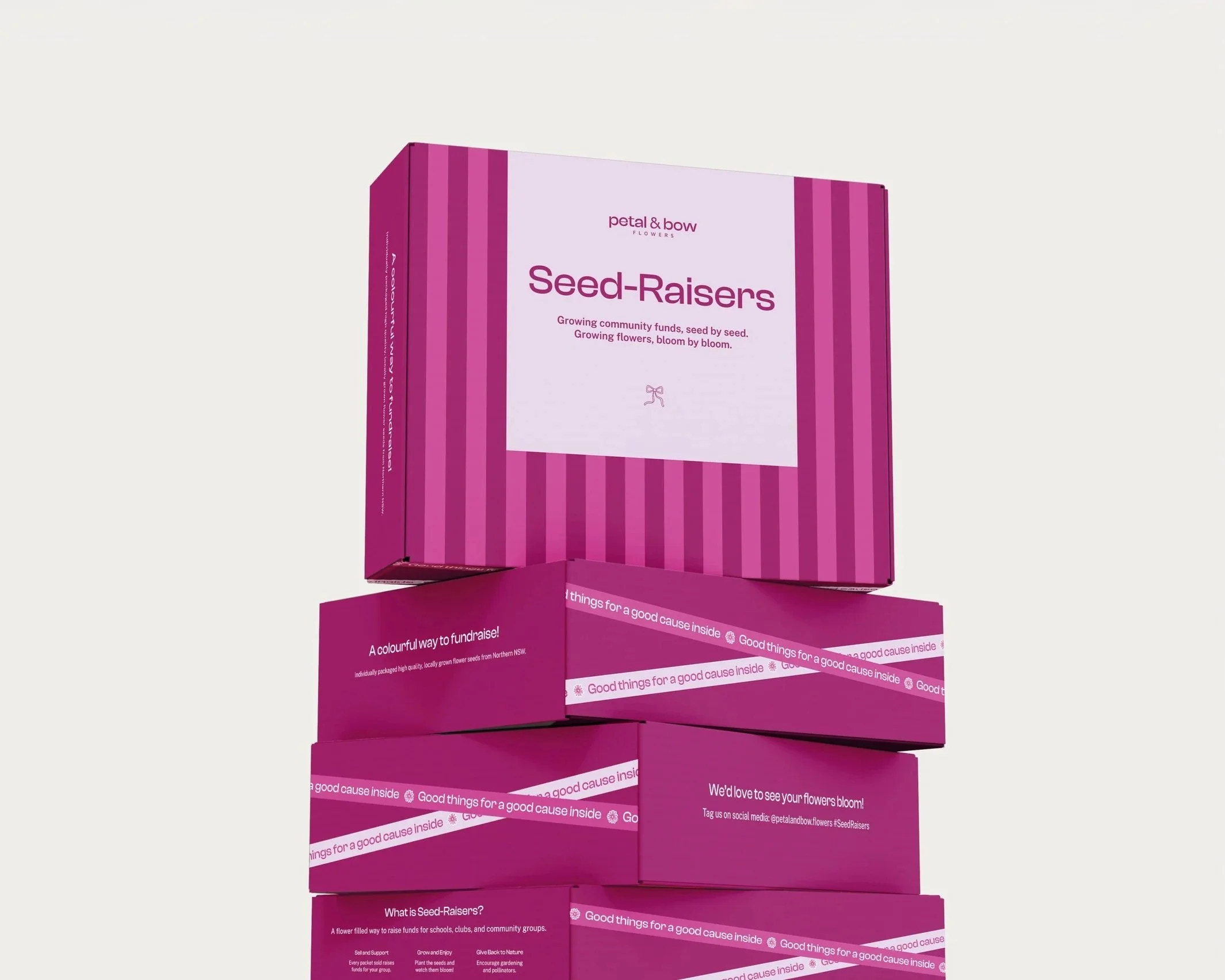 Pink boxes stacked with the top box labeled 'Seed-Raisers' and additional promotional text, promoting fundraising for community groups.