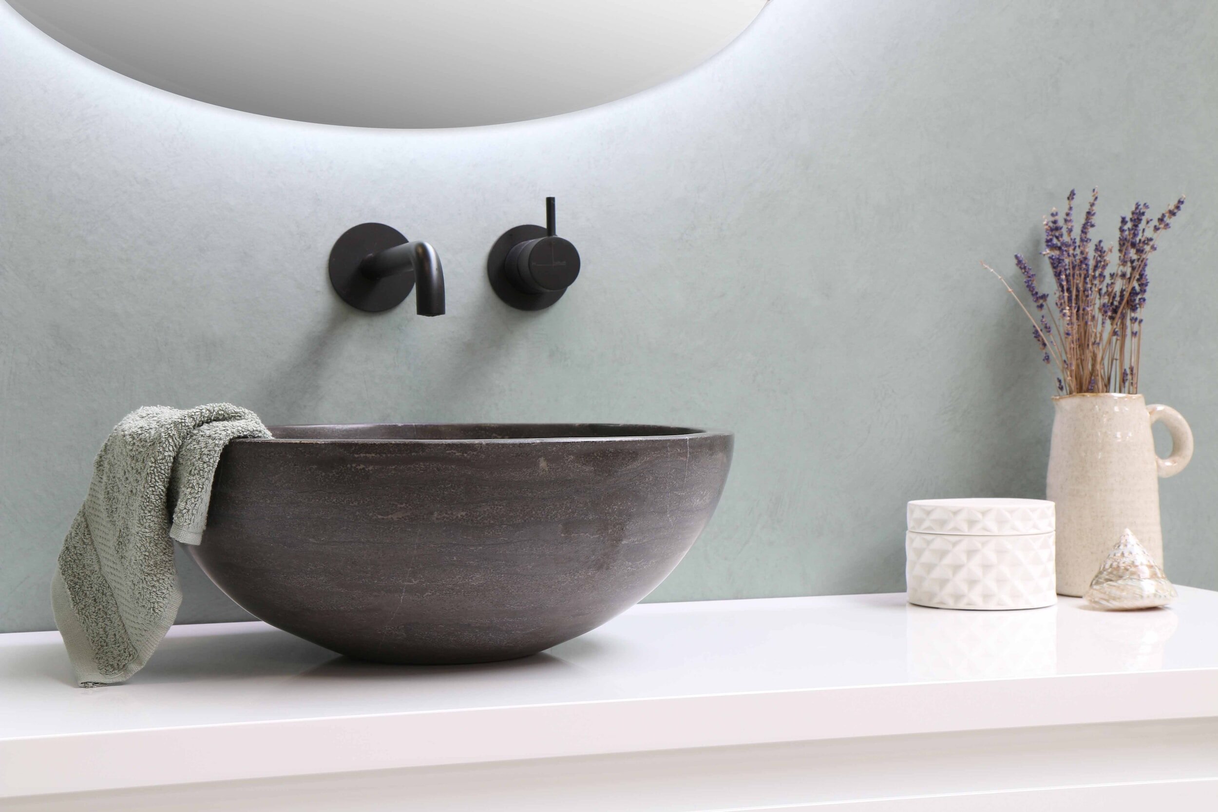 Modern bathroom finishes with stone basin, maximising space in bathroom