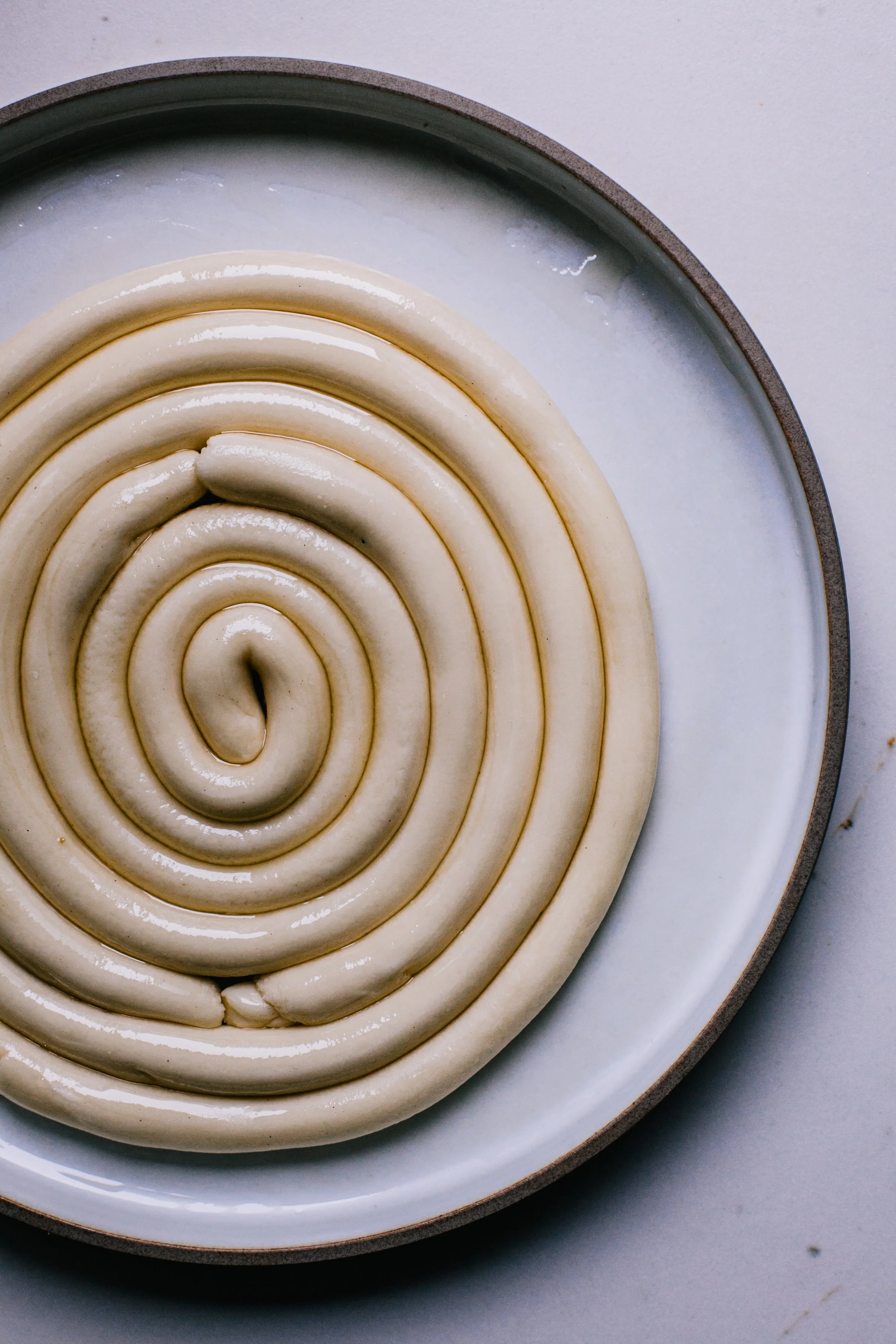 6. Coil the ropes onto an oiled plate and rest
