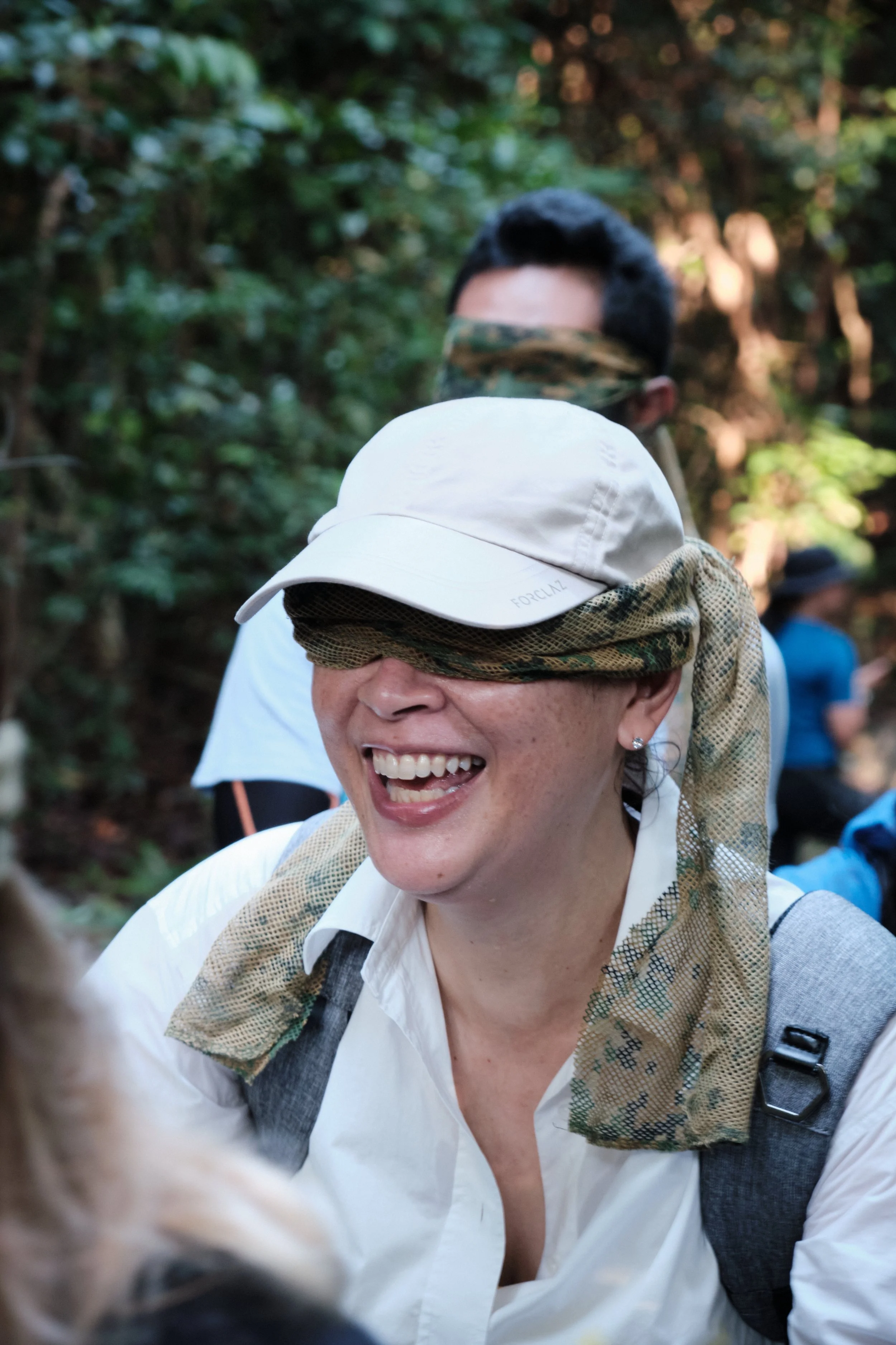 Smiling participant during a Fort Serapong corporate team bonding experience in Sentosa, Singapore